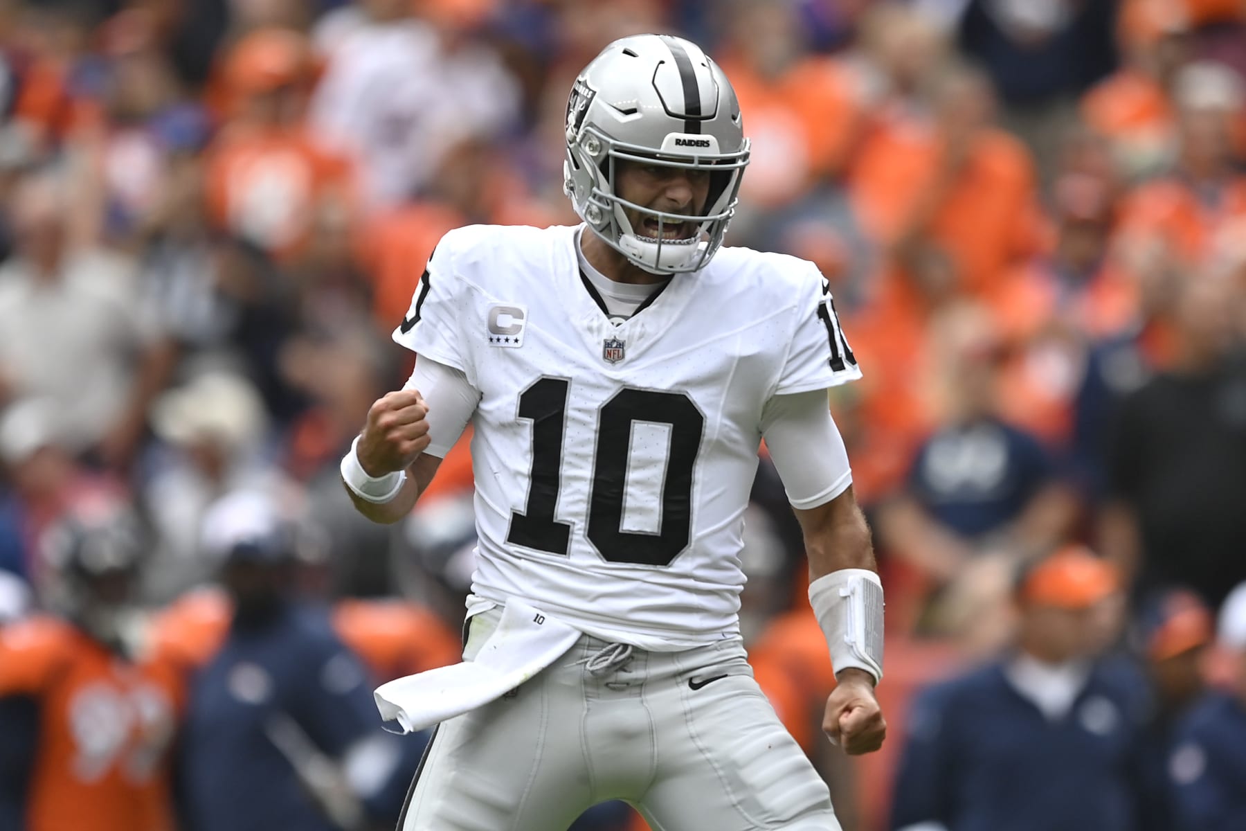 DENVER, COLORADO - SEPTEMBER 10: Jimmy Garoppolo #10 of the Las Vegas Raiders reacts after throwing a touchdown pass during the first quarter against the Denver Broncos at Empower Field At Mile High on September 10, 2023 in Denver, Colorado. (Photo by Dustin Bradford/Getty Images)