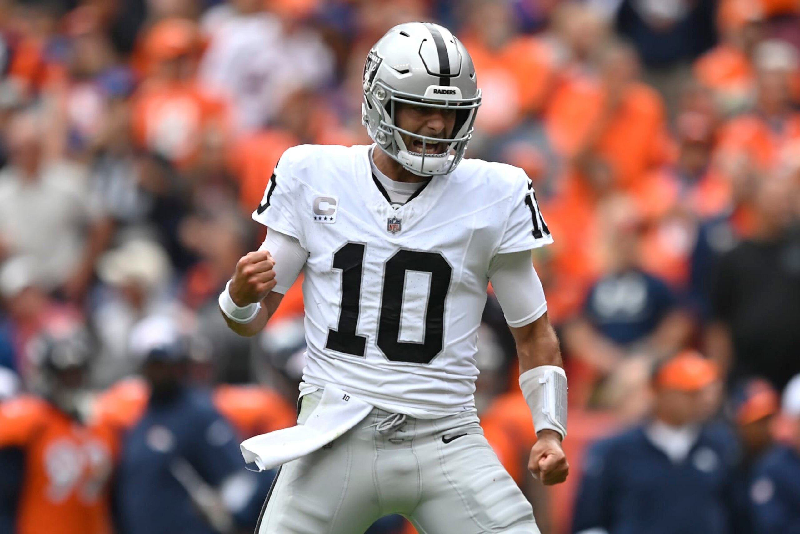 DENVER, COLORADO - SEPTEMBER 10: Jimmy Garoppolo #10 of the Las Vegas Raiders reacts after throwing a touchdown pass during the first quarter against the Denver Broncos at Empower Field At Mile High on September 10, 2023 in Denver, Colorado. (Photo by Dustin Bradford/Getty Images)