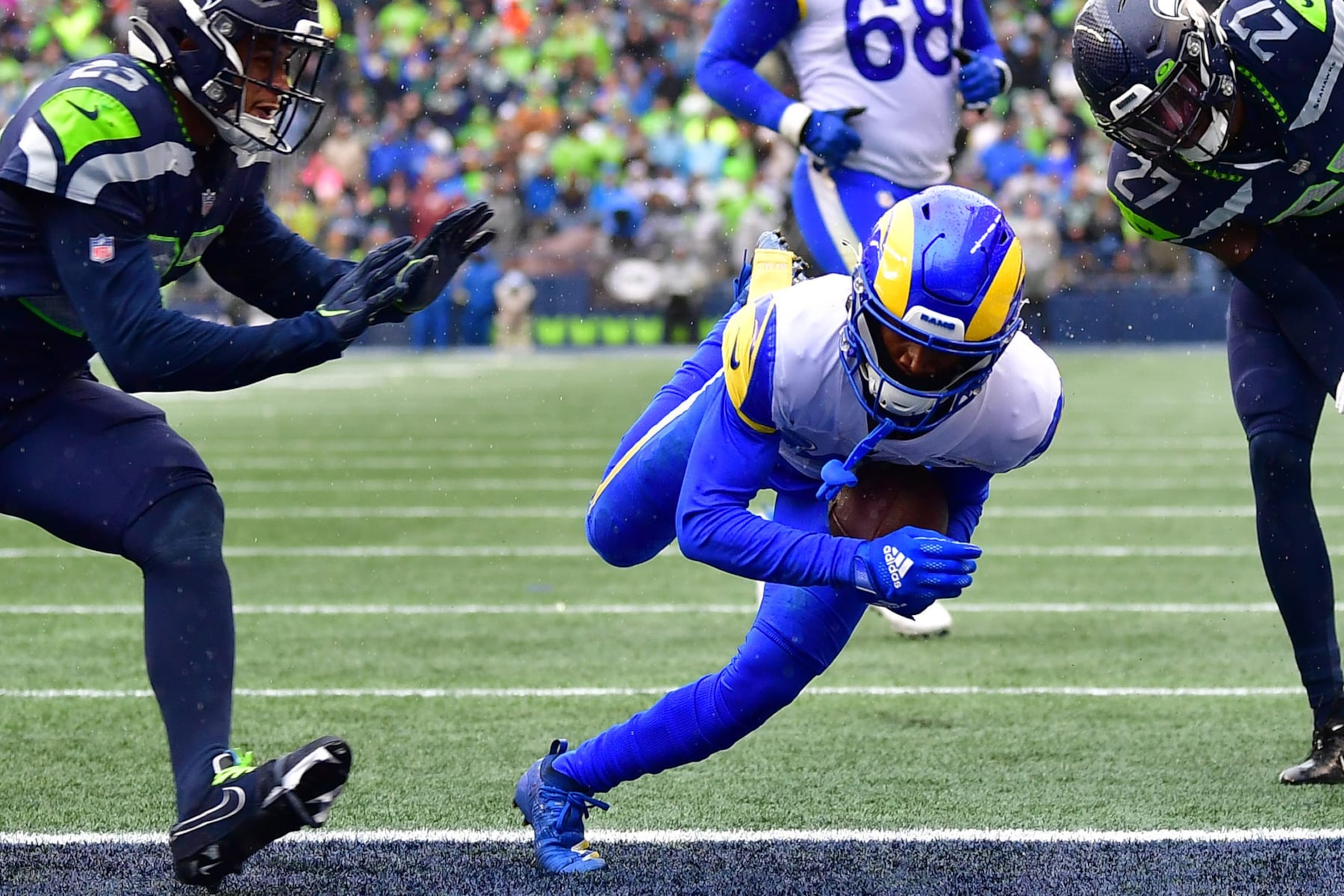 SEATTLE, WASHINGTON - JANUARY 08: Tutu Atwell #15 of the Los Angeles Rams scores a touchdown during the second quarter against the Seattle Seahawks at Lumen Field on January 08, 2023 in Seattle, Washington. (Photo by Jane Gershovich/Getty Images)