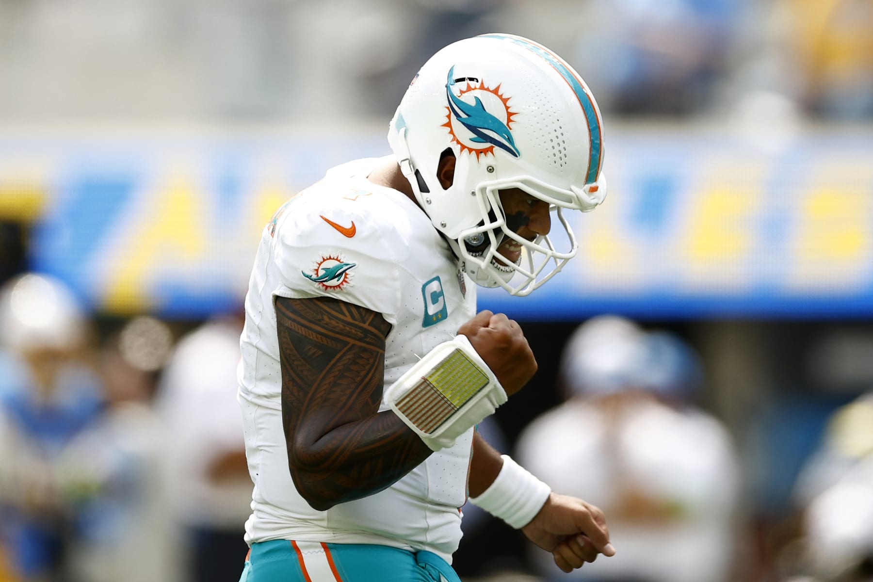 INGLEWOOD, CALIFORNIA - SEPTEMBER 10: Tua Tagovailoa #1 of the Miami Dolphins reacts after a touchdown in the first quarter of a game against the Los Angeles Chargers at SoFi Stadium on September 10, 2023 in Inglewood, California. (Photo by Ronald Martinez/Getty Images)