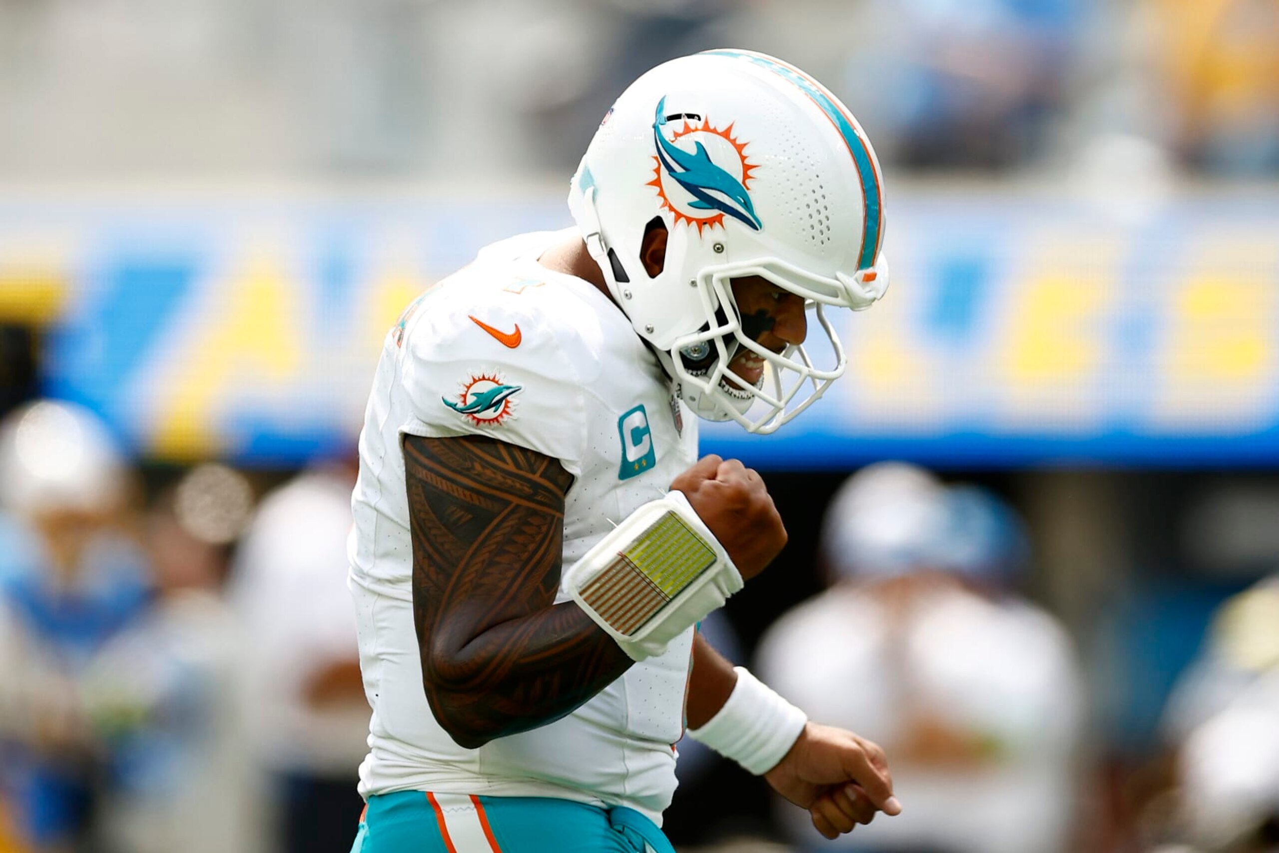INGLEWOOD, CALIFORNIA - SEPTEMBER 10: Tua Tagovailoa #1 of the Miami Dolphins reacts after a touchdown in the first quarter of a game against the Los Angeles Chargers at SoFi Stadium on September 10, 2023 in Inglewood, California. (Photo by Ronald Martinez/Getty Images)