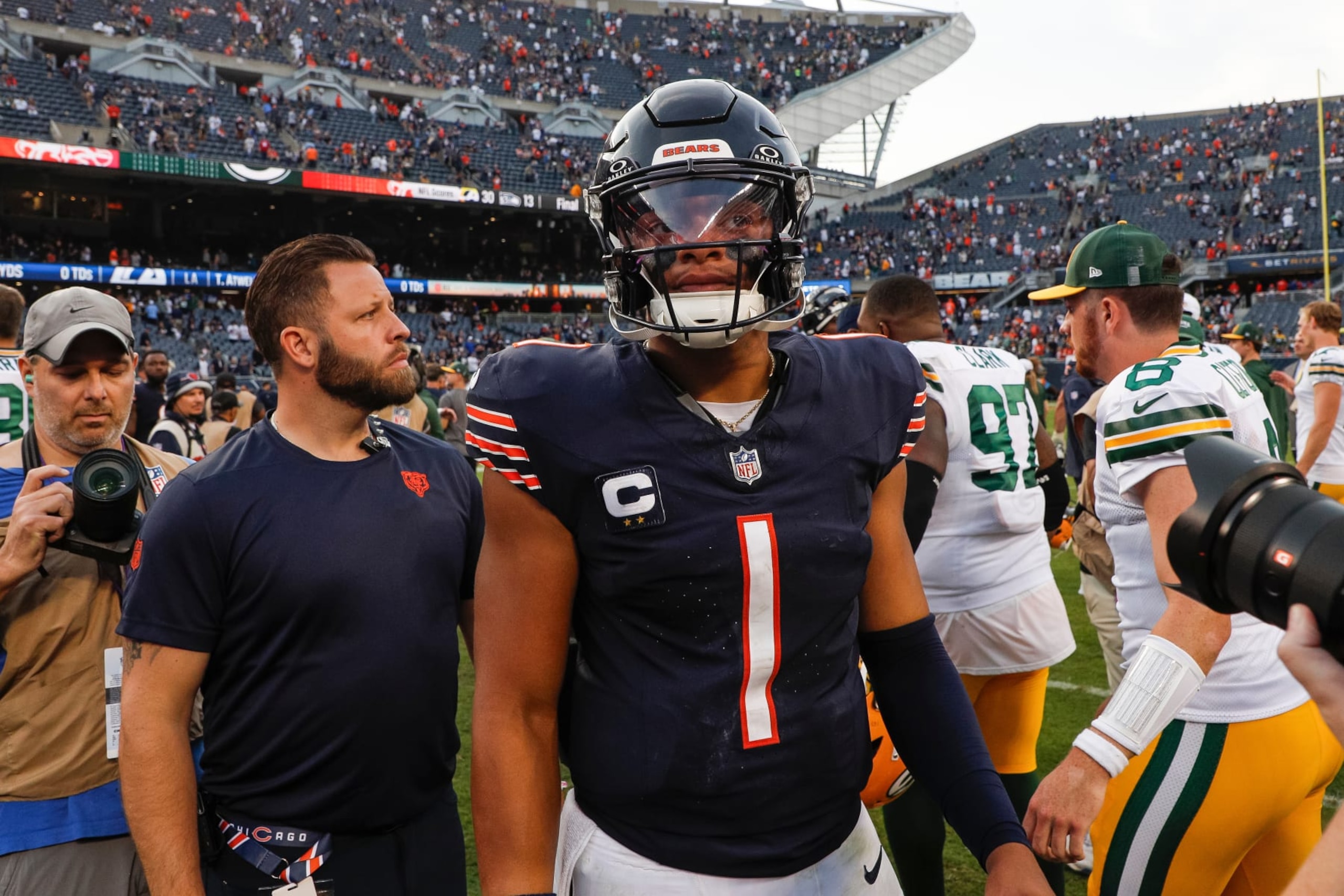 CHICAGO, IL - SEPTEMBER 10: Chicago Bears quarterback Justin Fields (1) walks on the field after losing to the Packers 38-20 on September, 10, 2023, at Soldier Field in Chicago, IL. (Photo by Brandon Sloter/Icon Sportswire via Getty Images)
