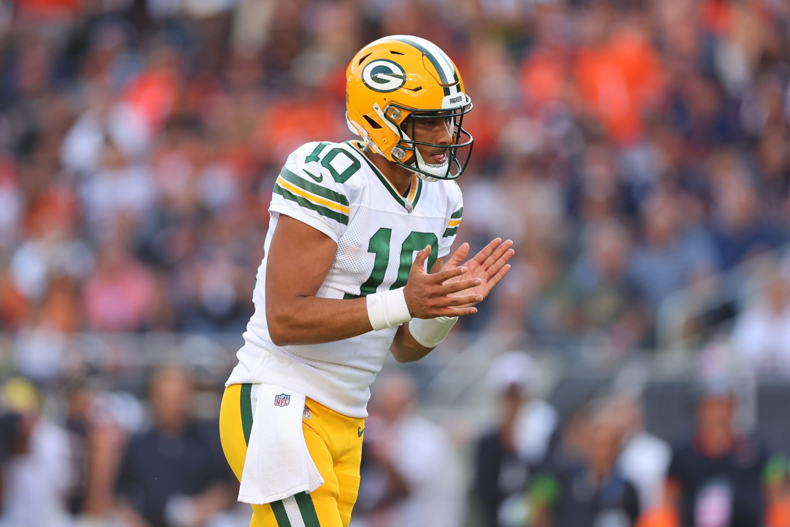 CHICAGO, ILLINOIS - SEPTEMBER 10:  Jordan Love #10 of the Green Bay Packers celebrates a rushing touchdown by teammate Aaron Jones (not pictured) against the Chicago Bears during the second half at Soldier Field on September 10, 2023 in Chicago, Illinois. (Photo by Michael Reaves/Getty Images)