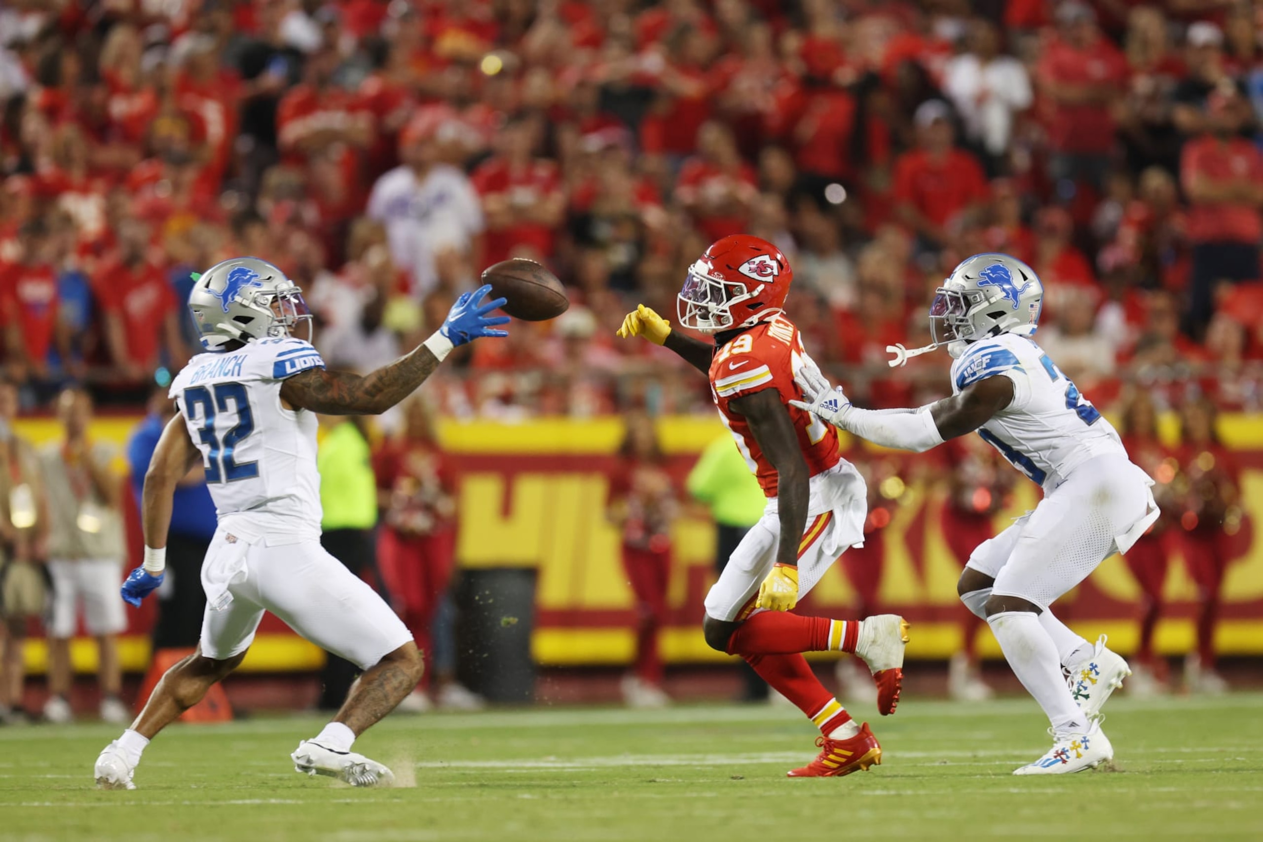 KANSAS CITY, MISSOURI - SEPTEMBER 07: Brian Branch #32 of the Detroit Lions intercepts a pass intended for Kadarius Toney #19 of the Kansas City Chiefs for a touchdown in the third quarter at GEHA Field at Arrowhead Stadium on September 07, 2023 in Kansas City, Missouri. (Photo by Jamie Squire/Getty Images)
