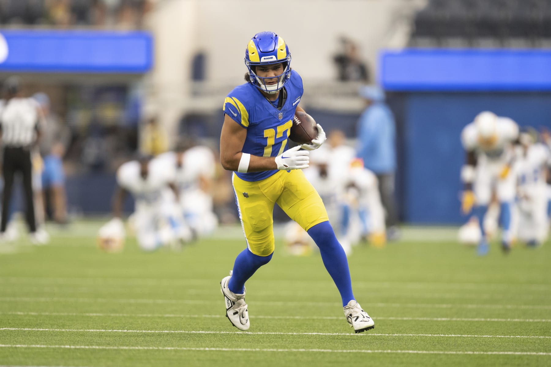 Los Angeles Rams wide receiver Puka Nacua (17) runs with the ball before an NFL preseason football game ast the Los Angeles Chargers, Saturday, Aug. 12, 2023, in Inglewood, Calif. (AP Photo/Kyusung Gong)
