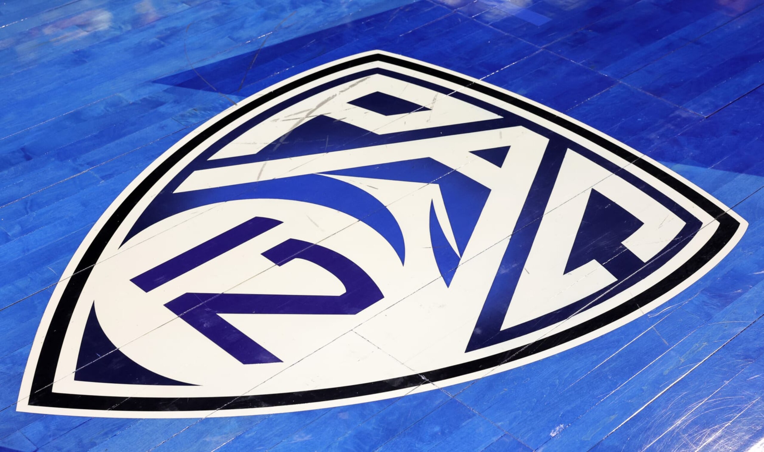 LAS VEGAS, NEVADA - MARCH 05: A Pac-12 Conference logo is shown on the court before the Pac-12 Conference women's basketball tournament championship game between the Washington State Cougars and the UCLA Bruins at Michelob ULTRA Arena on March 05, 2023 in Las Vegas, Nevada. The Cougars defeated the Bruins 65-61. (Photo by Ethan Miller/Getty Images) LAS VEGAS, NEVADA - MARCH 05: A Pac-12 Conference logo is shown on the court before the Pac-12 Conference women's basketball tournament championship game between the Washington State Cougars and the UCLA Bruins at Michelob ULTRA Arena on March 05, 2023 in Las Vegas, Nevada. The Cougars defeated the Bruins 65-61. (Photo by Ethan Miller/Getty Images)