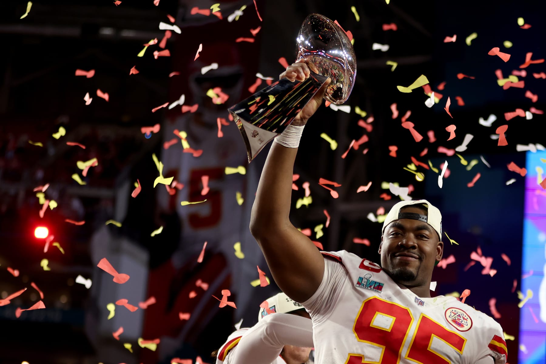 GLENDALE, ARIZONA - FEBRUARY 12:  Chris Jones #95 of the Kansas City Chiefs celebrates with The Vince Lombardi Trophy after defeating the Philadelphia Eagles 38 to 35 in Super Bowl LVII at State Farm Stadium on February 12, 2023 in Glendale, Arizona. (Photo by Gregory Shamus/Getty Images)