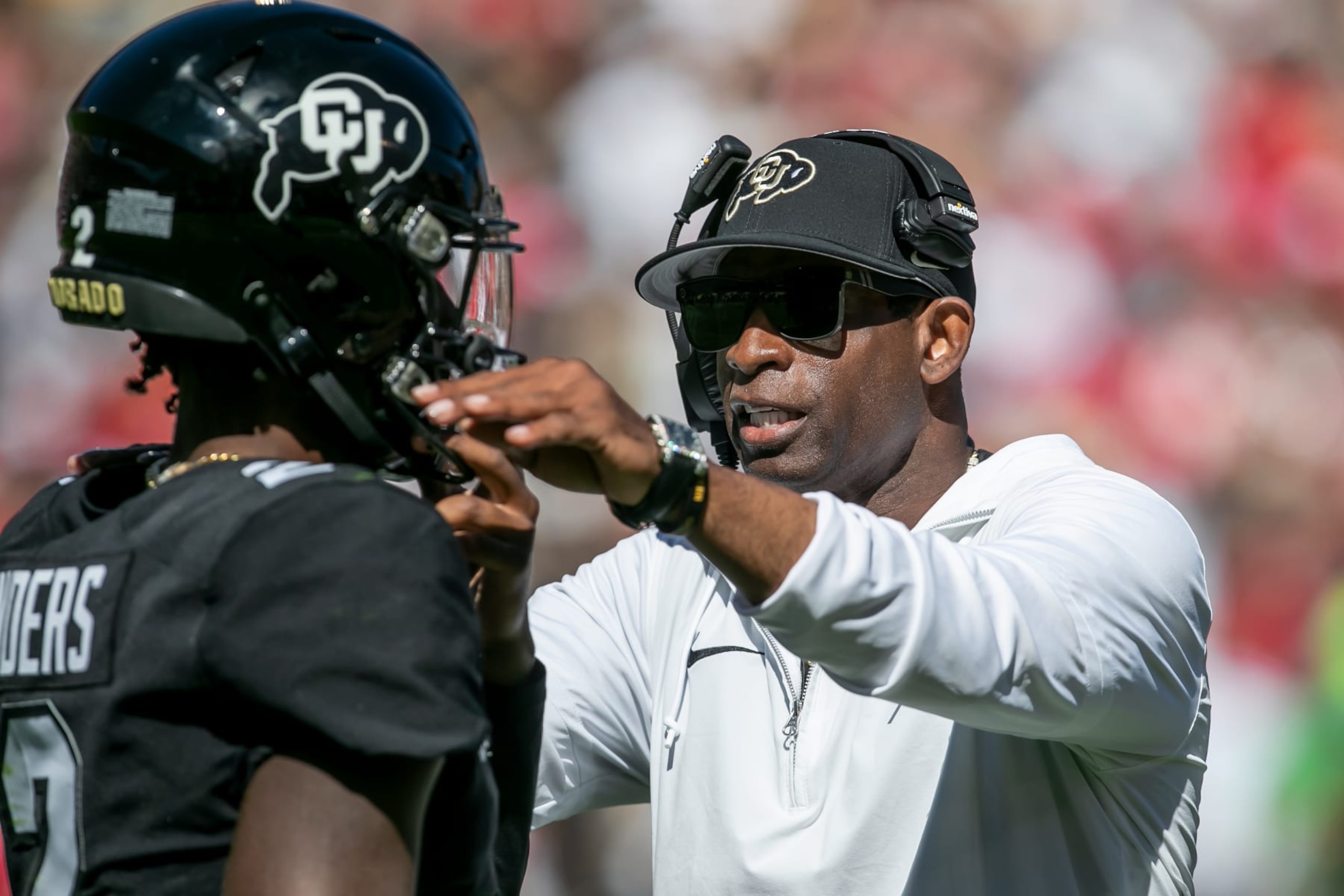 BOULDER, CO - SEPTEMBER 09: Colorado head coach Deion Sanders speaks with Colorado quarterback Shedeur Sanders (2) between plays during the home opener game between the Colorado Buffaloes and the the Nebraska Cornhuskers on Saturday, September 9, 2023 at Folsom Field in Boulder, CO.  (Photo by Nick Tre. Smith/Icon Sportswire via Getty Images)