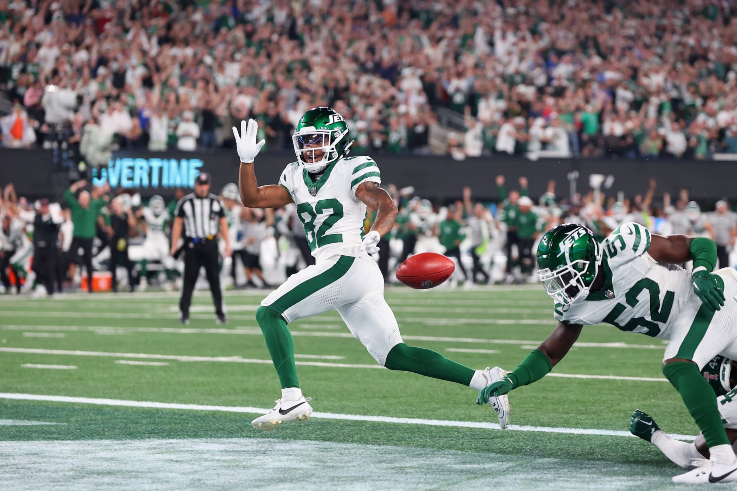 EAST RUTHERFORD, NEW JERSEY - SEPTEMBER 11: Wide receiver Xavier Gipson #82 of the New York Jets scores the game winning touchdown on a 65-yard punt return during the overtime quarter of the NFL game against the Buffalo Bills at MetLife Stadium on September 11, 2023 in East Rutherford, New Jersey. (Photo by Mike Stobe/Getty Images)