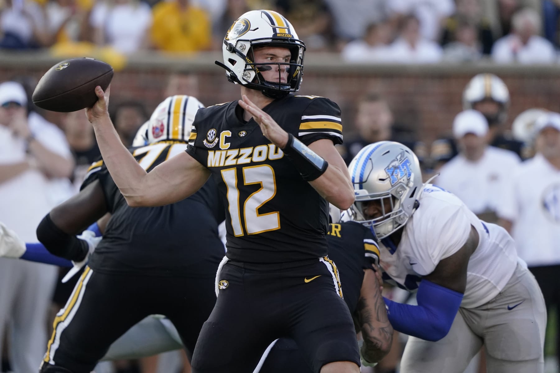 COLUMBIA, MISSOURI - SEPTEMBER 09: Quarterback Brady Cook #12 of the Missouri Tigers passes against the Middle Tennessee Blue Raiders in the first half at Faurot Field at Memorial Stadium on September 09, 2023 in Columbia, Missouri. (Photo by Ed Zurga/Getty Images)