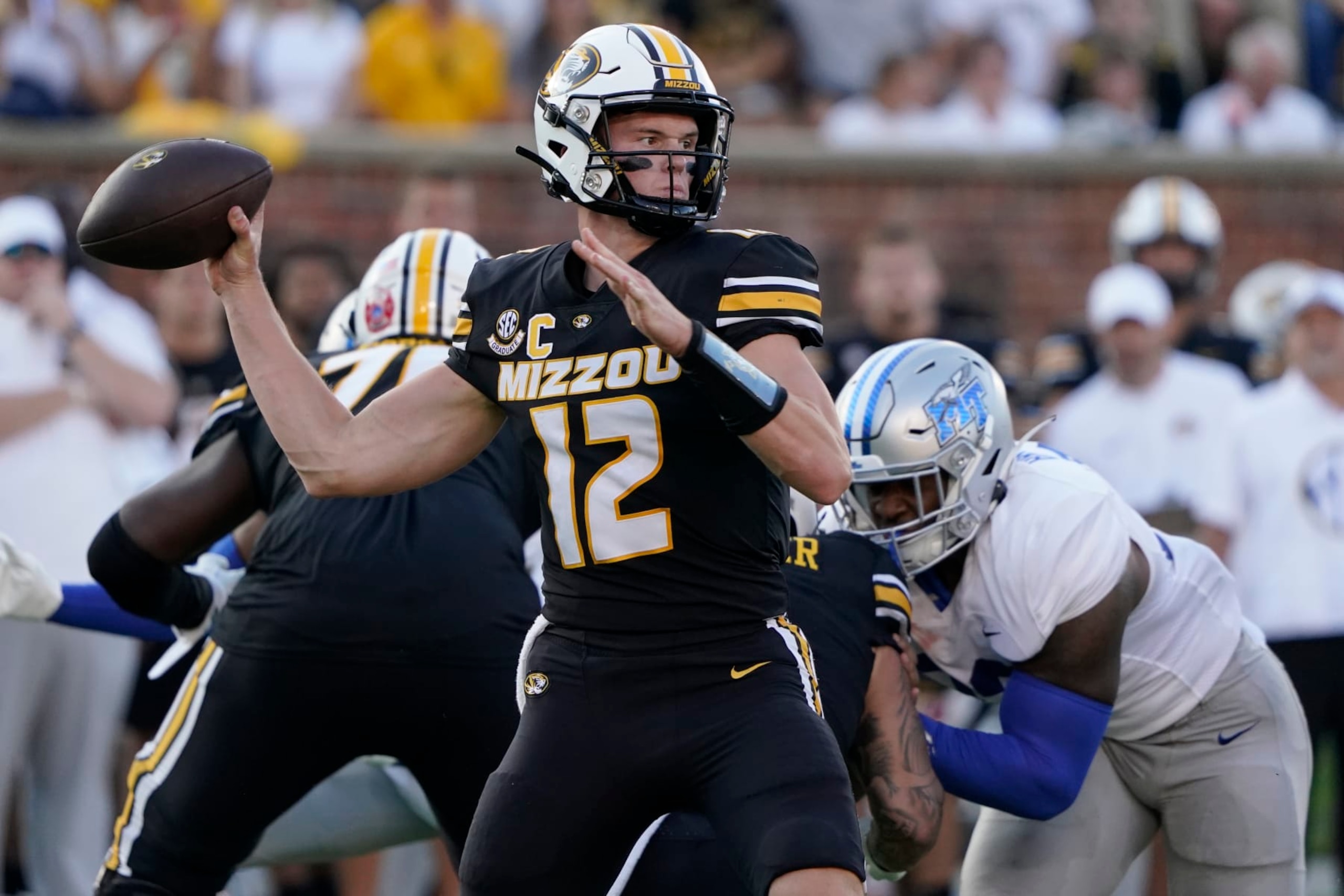 COLUMBIA, MISSOURI - SEPTEMBER 09: Quarterback Brady Cook #12 of the Missouri Tigers passes against the Middle Tennessee Blue Raiders in the first half at Faurot Field at Memorial Stadium on September 09, 2023 in Columbia, Missouri. (Photo by Ed Zurga/Getty Images)