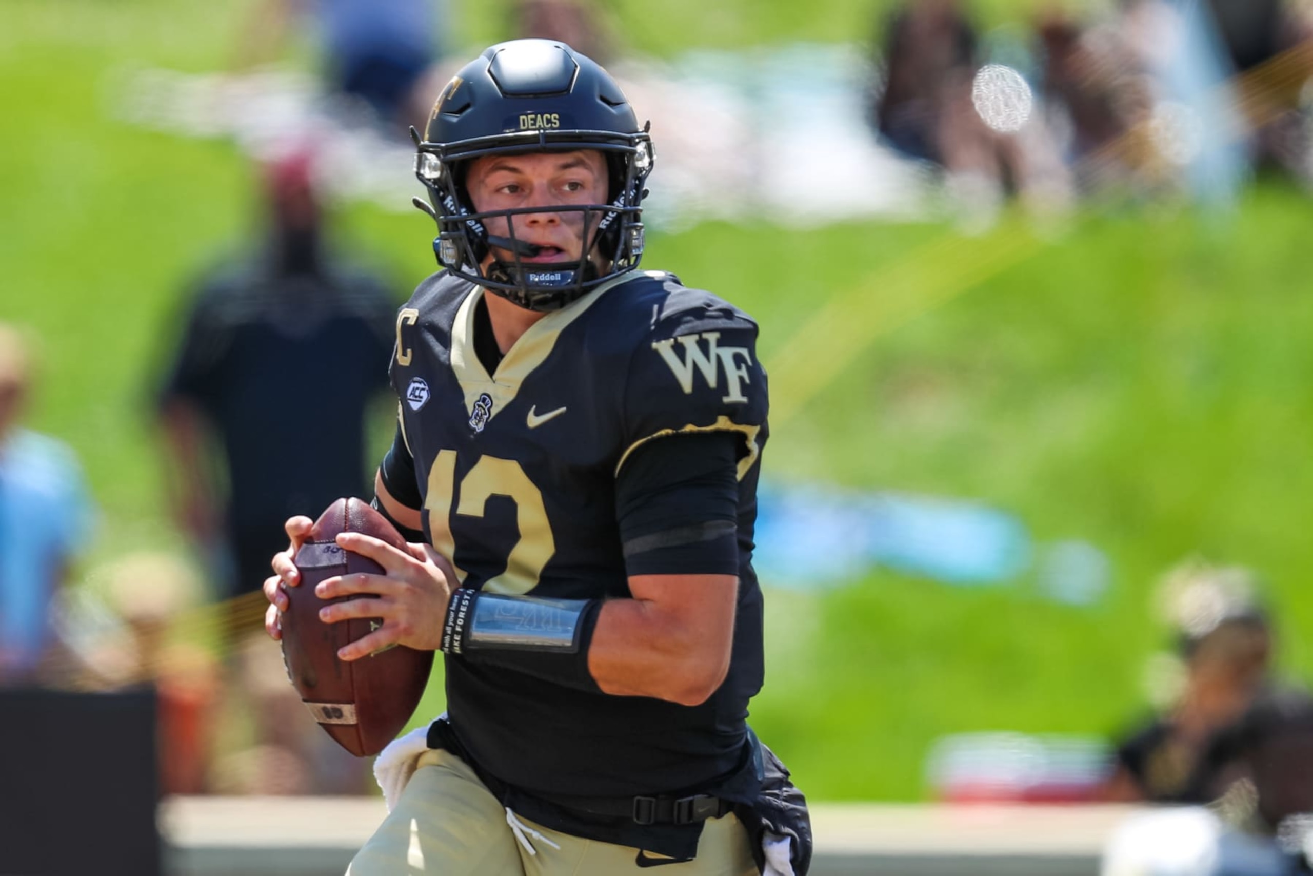 WINSTON-SALEM, NC - SEPTEMBER 09: Mitch Griffis #12 of the Wake Forest Demon Deacons looks to pass the ball during a football game against the Vanderbilt Commodores at Allegacy Federal Credit Union Stadium in Winston-Salem, North Carolina on Sep 9, 2023.  (Photo by David Jensen/Icon Sportswire via Getty Images)