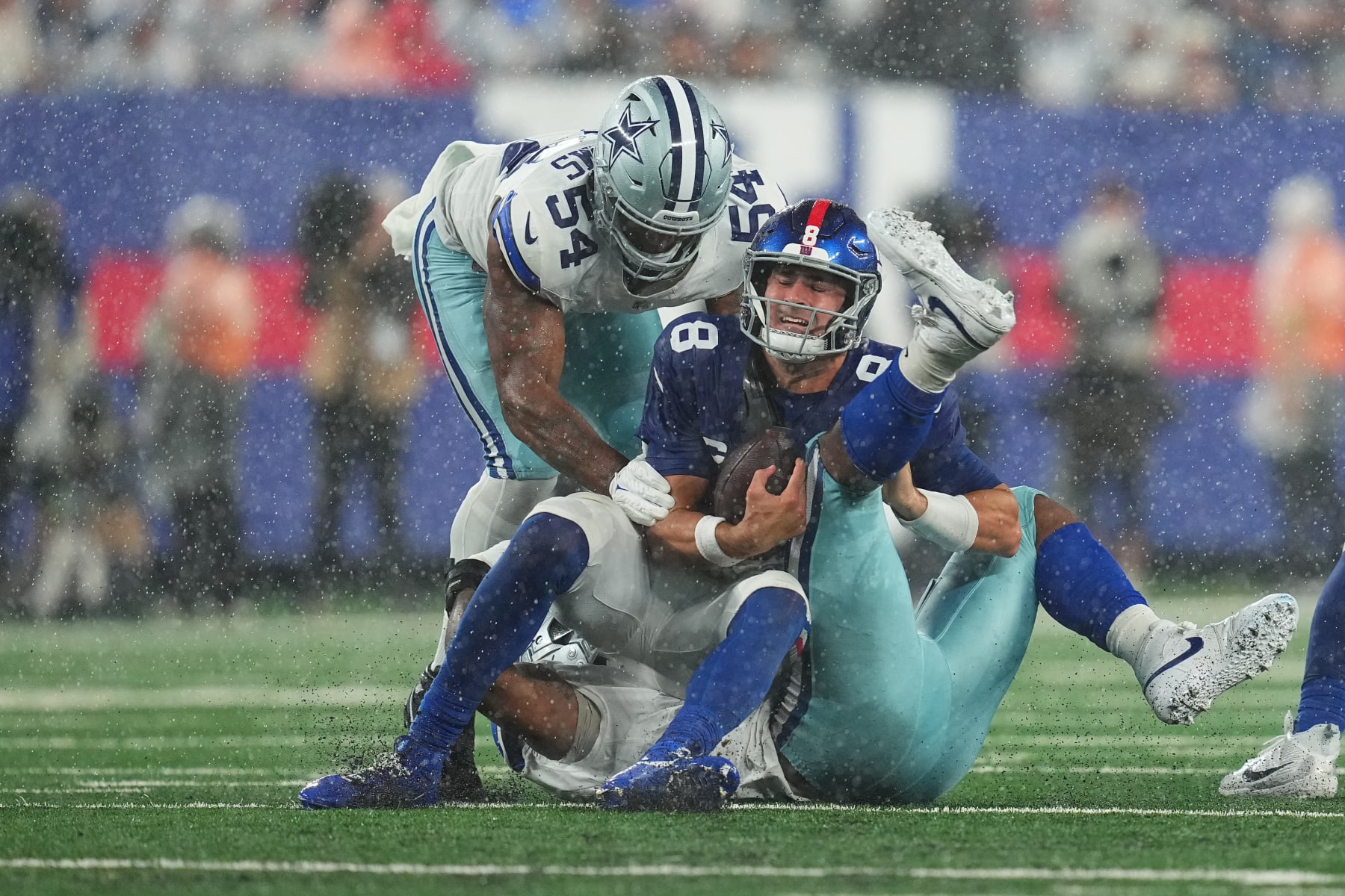 EAST RUTHERFORD, NEW JERSEY - SEPTEMBER 10: Micah Parsons #11 of the Dallas Cowboys tackles Daniel Jones #8 of the New York Giants at MetLife Stadium on September 10, 2023 in East Rutherford, New Jersey. (Photo by Mitchell Leff/Getty Images)