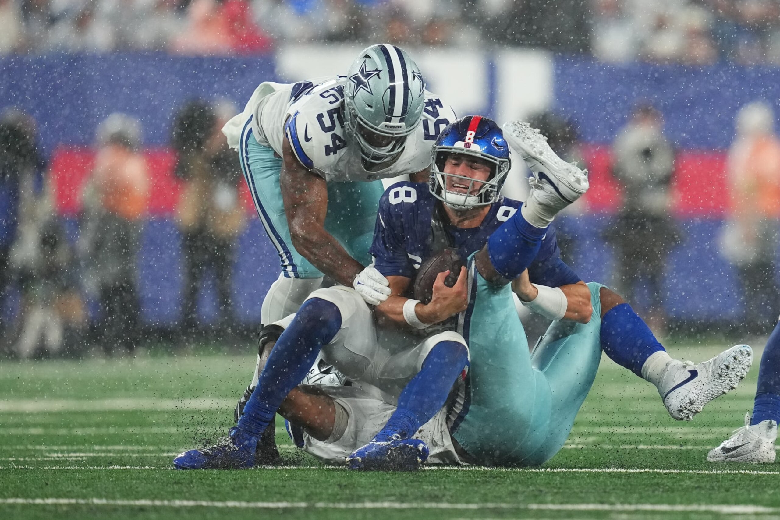 EAST RUTHERFORD, NEW JERSEY - SEPTEMBER 10: Micah Parsons #11 of the Dallas Cowboys tackles Daniel Jones #8 of the New York Giants at MetLife Stadium on September 10, 2023 in East Rutherford, New Jersey. (Photo by Mitchell Leff/Getty Images)