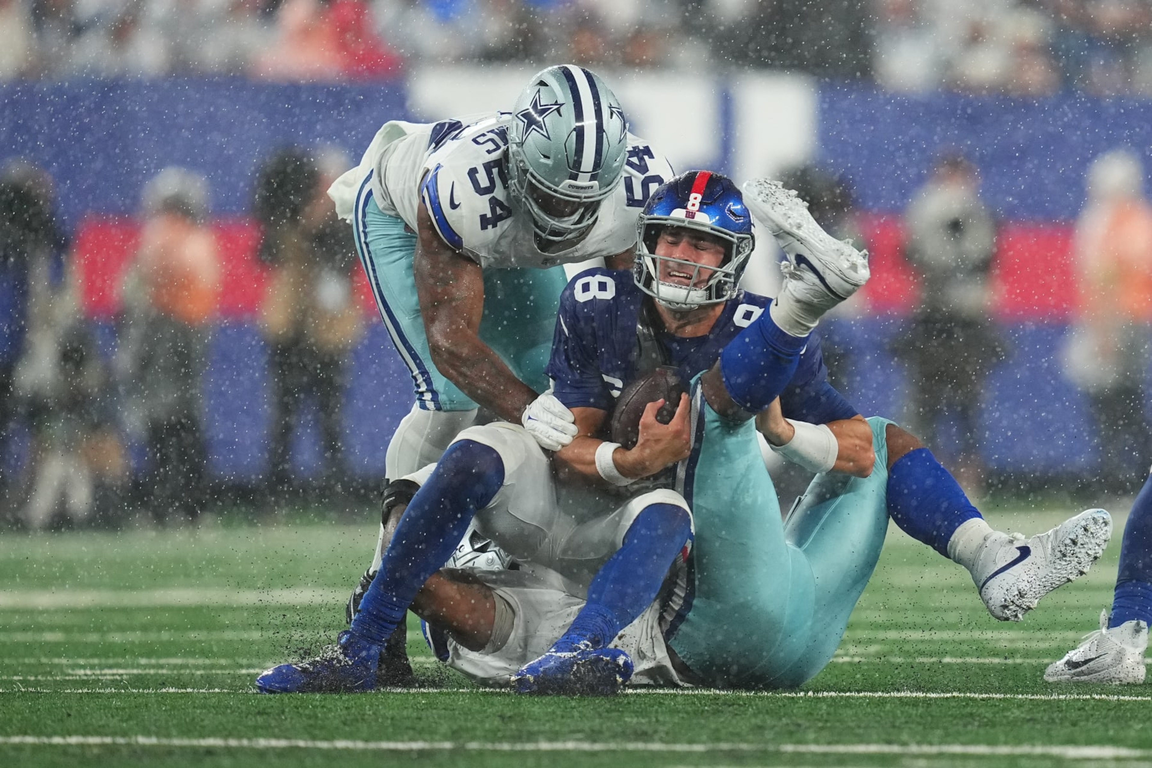 EAST RUTHERFORD, NEW JERSEY - SEPTEMBER 10: Micah Parsons #11 of the Dallas Cowboys tackles Daniel Jones #8 of the New York Giants at MetLife Stadium on September 10, 2023 in East Rutherford, New Jersey. (Photo by Mitchell Leff/Getty Images)