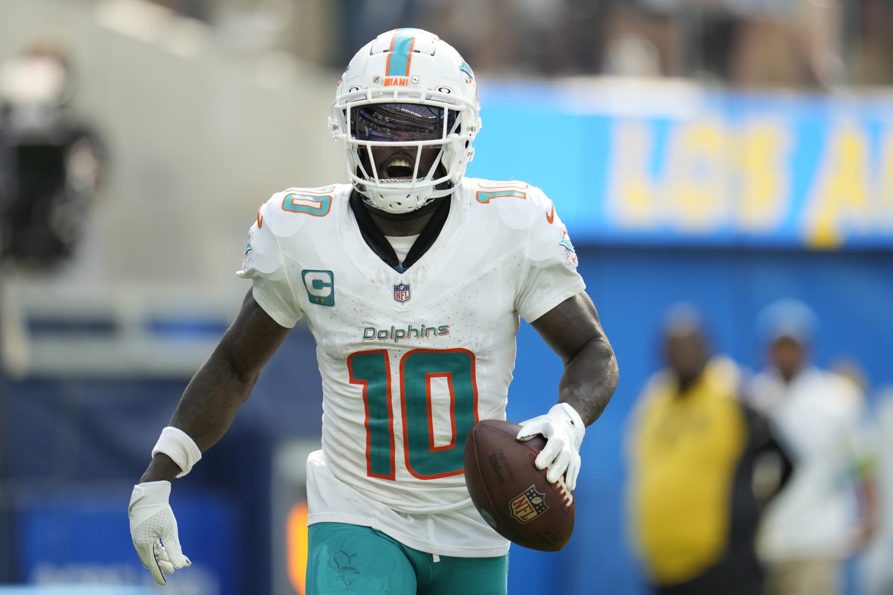 Miami Dolphins wide receiver Tyreek Hill celebrates his touchdown catch during the second half of an NFL football game against the Los Angeles Chargers Sunday, Sept. 10, 2023, in Inglewood, Calif. (AP Photo/Ashley Landis)