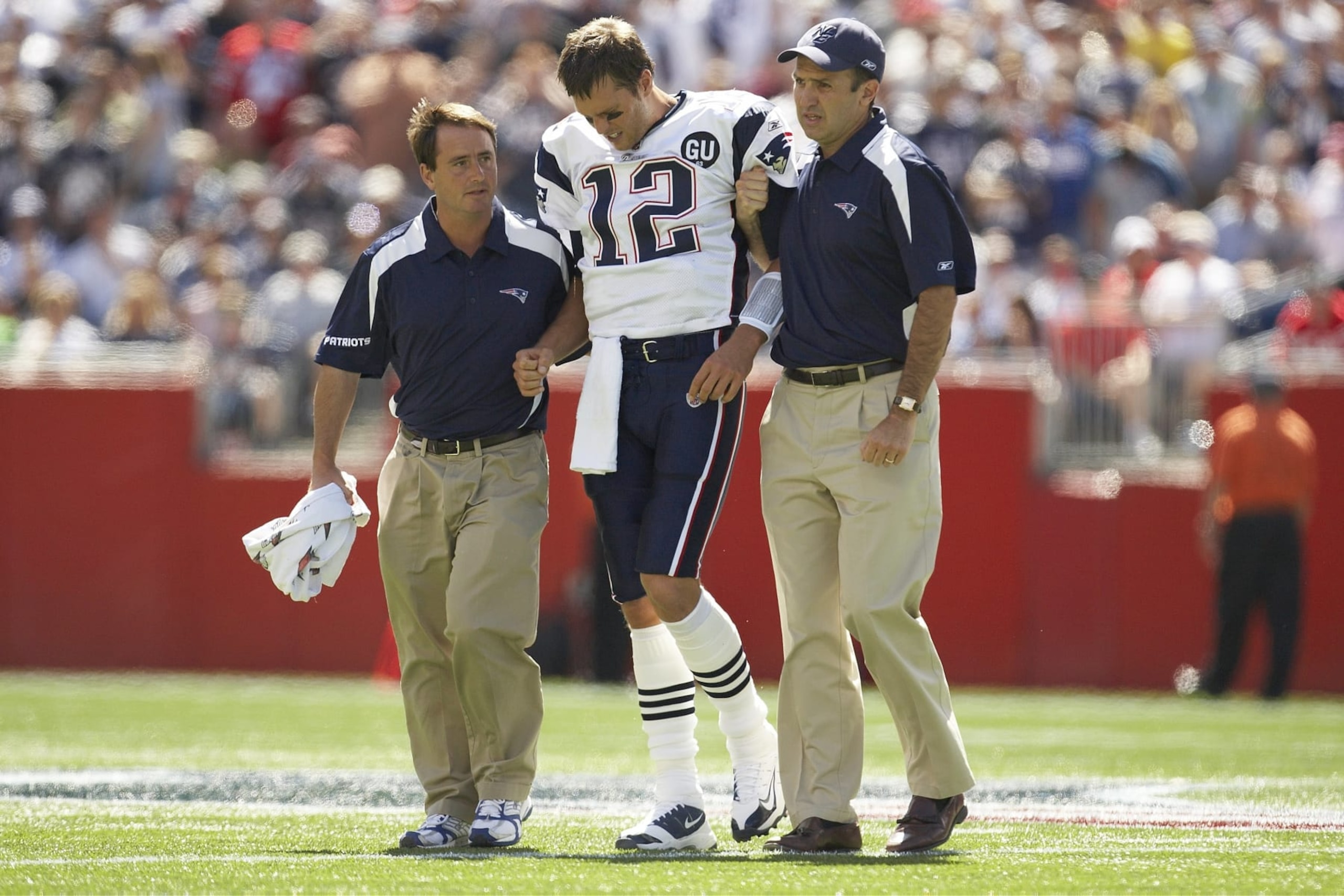 Football: New England Patriots QB Tom Brady (12) helped off field after injury vs Kansas City Chiefs. Foxboro, MA 9/7/2008 CREDIT: Damian Strohmeyer (Photo by Damian Strohmeyer /Sports Illustrated via Getty Images) (Set Number: X80977 TK1 R4 F166 )