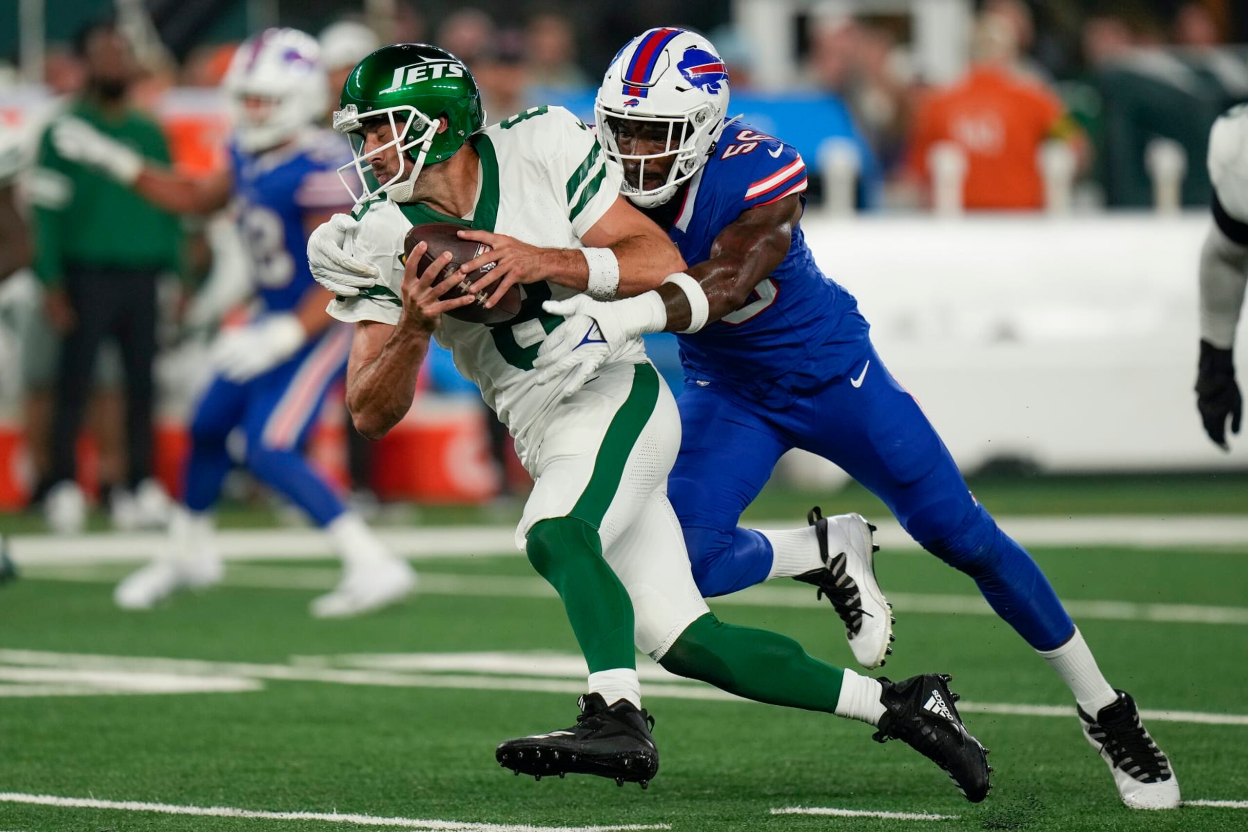 New York Jets quarterback Aaron Rodgers (8) is sacked by Buffalo Bills defensive end Leonard Floyd (56) during the first quarter of an NFL football game, Monday, Sept. 11, 2023, in East Rutherford, N.J. (AP Photo/Seth Wenig) New York Jets quarterback Aaron Rodgers (8) is sacked by Buffalo Bills defensive end Leonard Floyd (56) during the first quarter of an NFL football game, Monday, Sept. 11, 2023, in East Rutherford, N.J. (AP Photo/Seth Wenig)