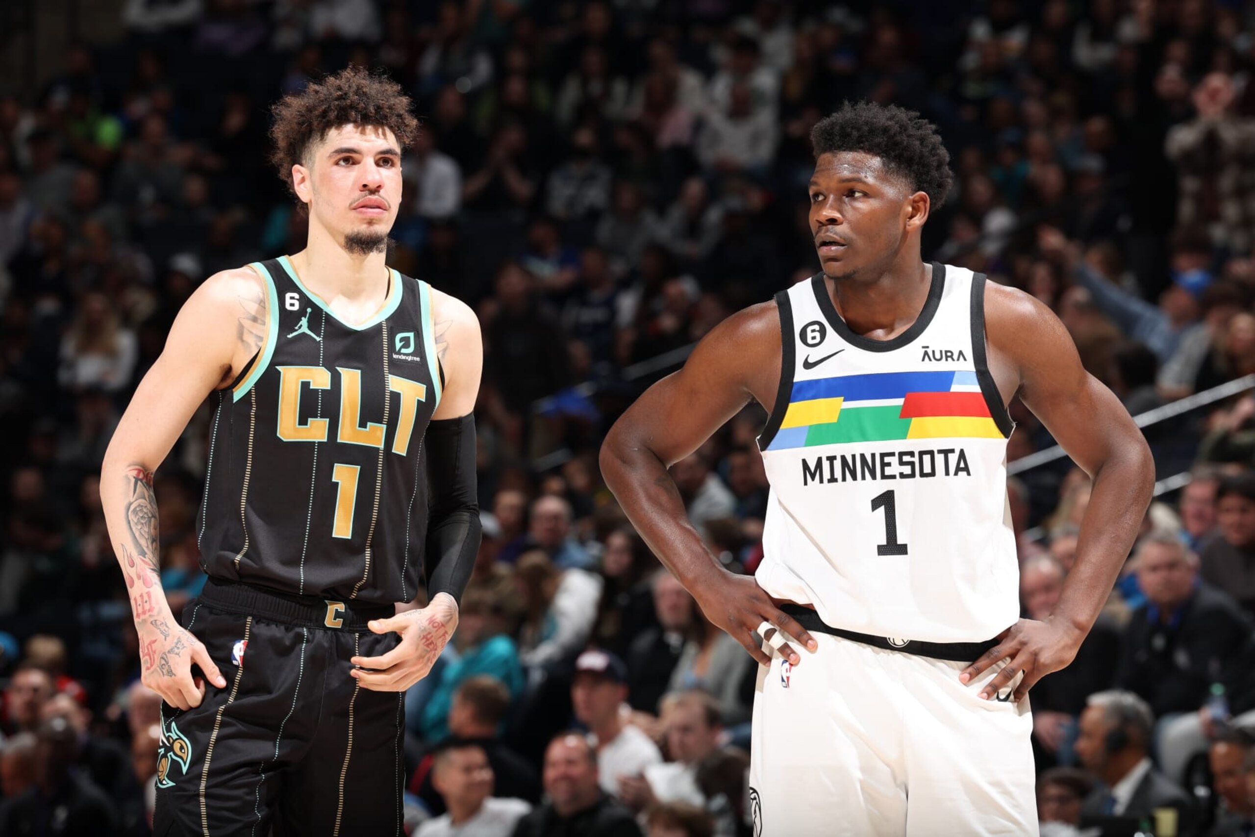 MINNEAPOLIS, MN -  FEBRUARY 24: LaMelo Ball #1 of the Charlotte Hornets and Anthony Edwards #1 of the Minnesota Timberwolves look on during the game on February 24, 2023 at Target Center in Minneapolis, Minnesota. NOTE TO USER: User expressly acknowledges and agrees that, by downloading and or using this Photograph, user is consenting to the terms and conditions of the Getty Images License Agreement. Mandatory Copyright Notice: Copyright 2023 NBAE (Photo by David Sherman/NBAE via Getty Images)