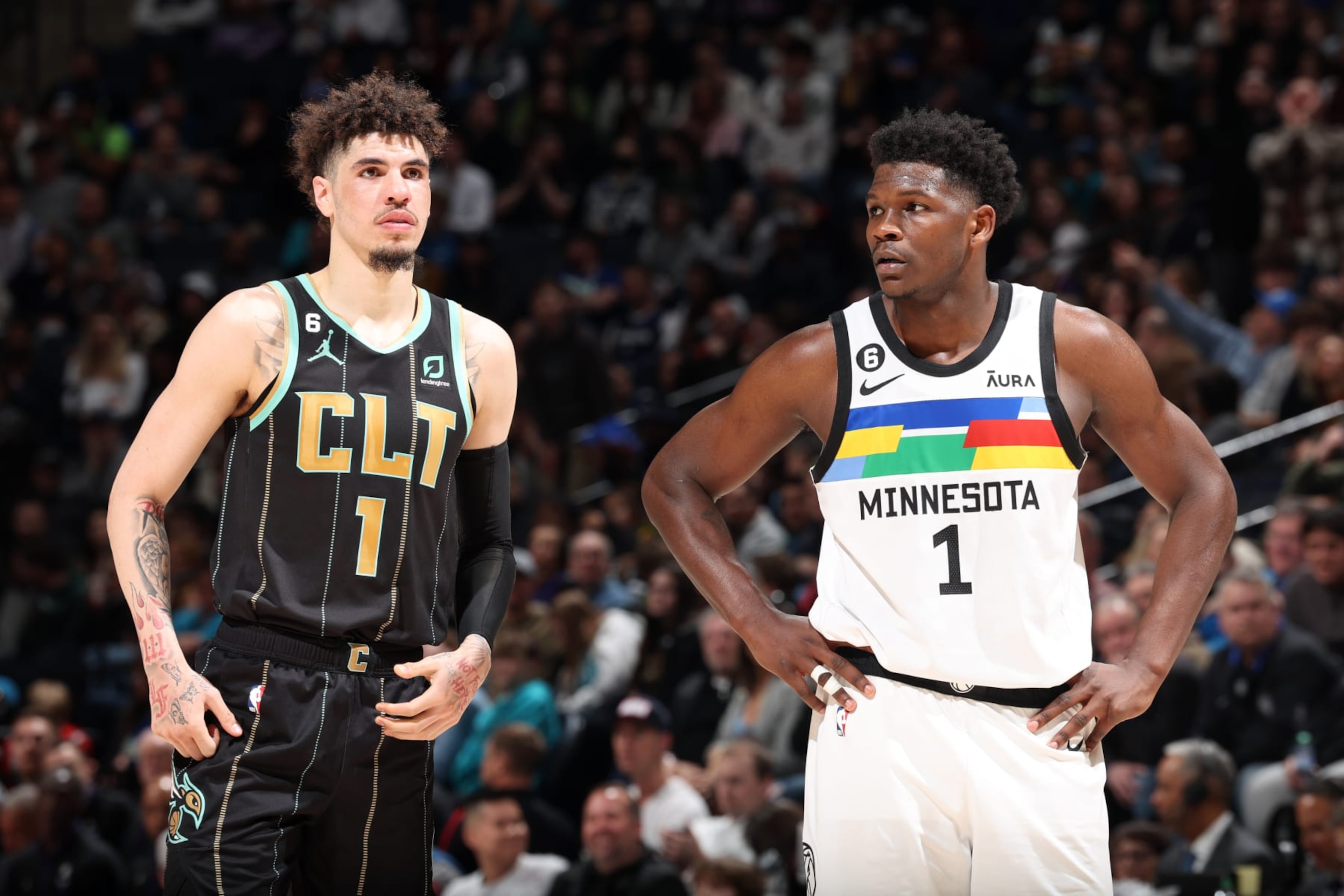 MINNEAPOLIS, MN -  FEBRUARY 24: LaMelo Ball #1 of the Charlotte Hornets and Anthony Edwards #1 of the Minnesota Timberwolves look on during the game on February 24, 2023 at Target Center in Minneapolis, Minnesota. NOTE TO USER: User expressly acknowledges and agrees that, by downloading and or using this Photograph, user is consenting to the terms and conditions of the Getty Images License Agreement. Mandatory Copyright Notice: Copyright 2023 NBAE (Photo by David Sherman/NBAE via Getty Images)