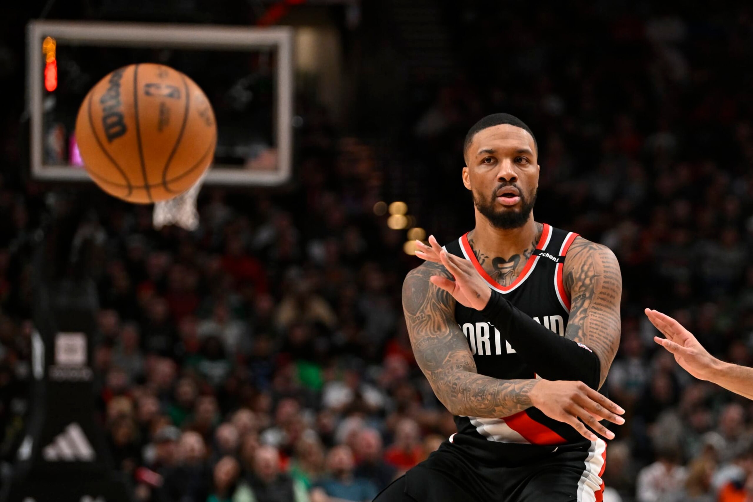 PORTLAND, OREGON - MARCH 17: Damian Lillard #0 of the Portland Trail Blazers passes the ball during the second quarter against the Boston Celtics at the Moda Center on March 17, 2023 in Portland, Oregon. NOTE TO USER: User expressly acknowledges and agrees that, by downloading and or using this photograph, User is consenting to the terms and conditions of the Getty Images License Agreement. (Photo by Alika Jenner/Getty Images)
