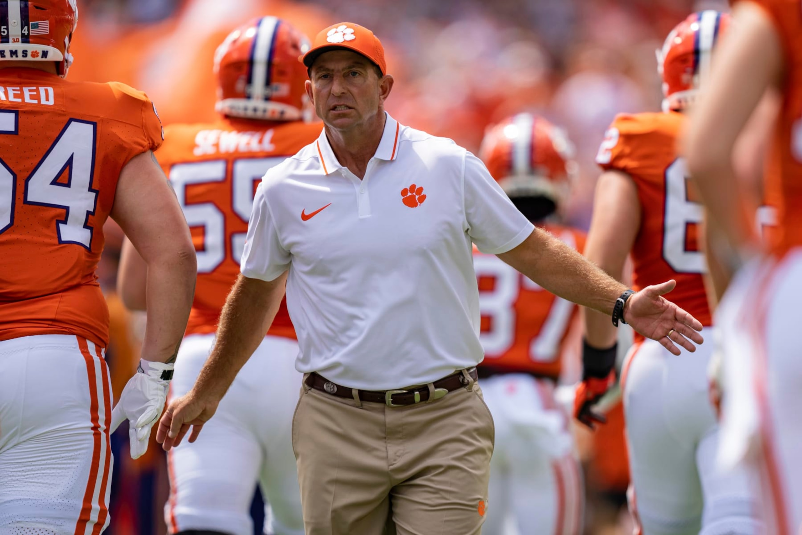 Clemson head coach Dabo Swinney greets players as the run onto the field before an NCAA college football game against Charleston Southern on Saturday, Sep. 9, 2023, in Clemson, S.C. (AP Photo/Jacob Kupferman)