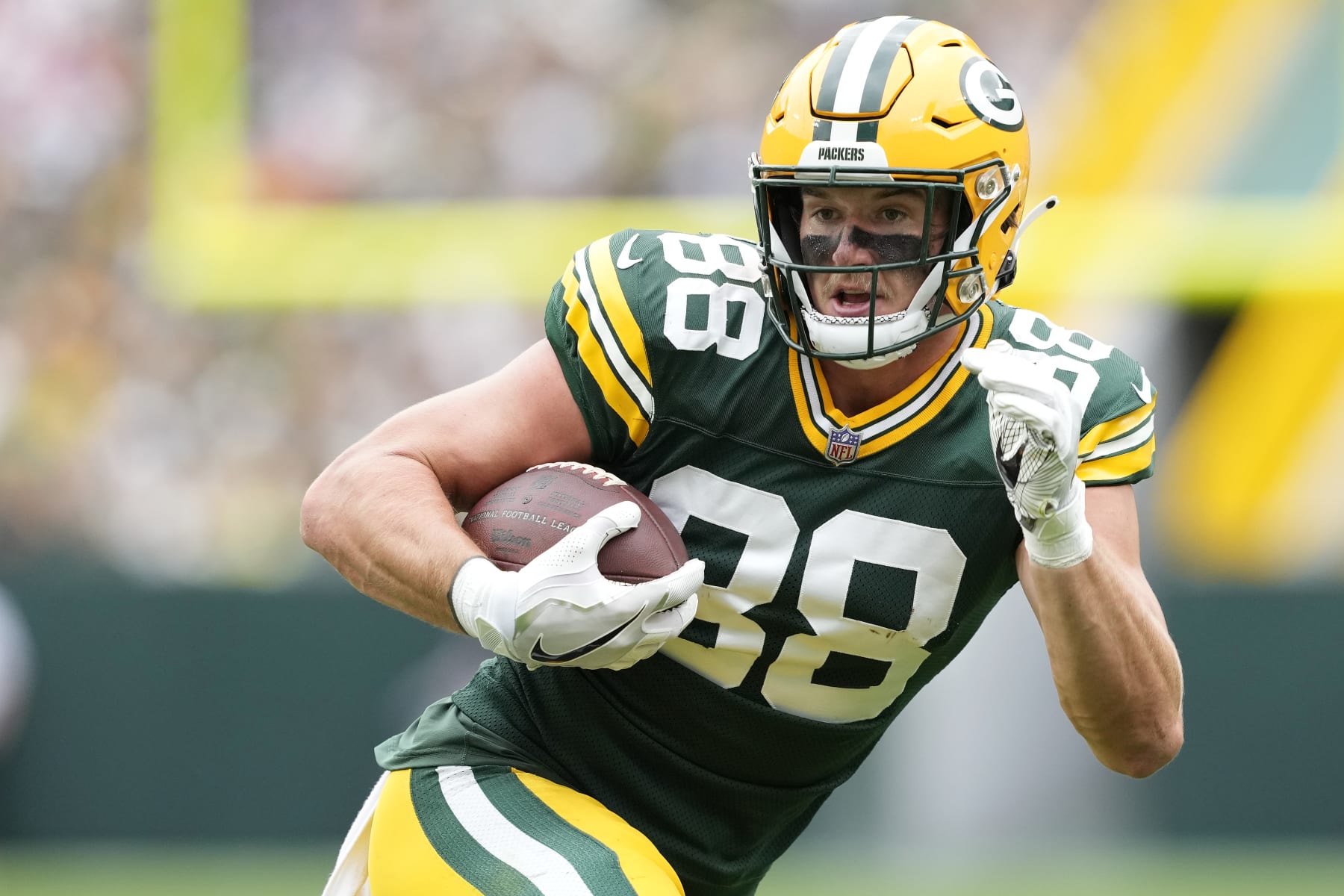 GREEN BAY, WISCONSIN - AUGUST 26: Luke Musgrave #88 of the Green Bay Packers runs with the ball after a catch in the first half against the Seattle Seahawks during a preseason game at Lambeau Field on August 26, 2023 in Green Bay, Wisconsin. (Photo by Patrick McDermott/Getty Images)