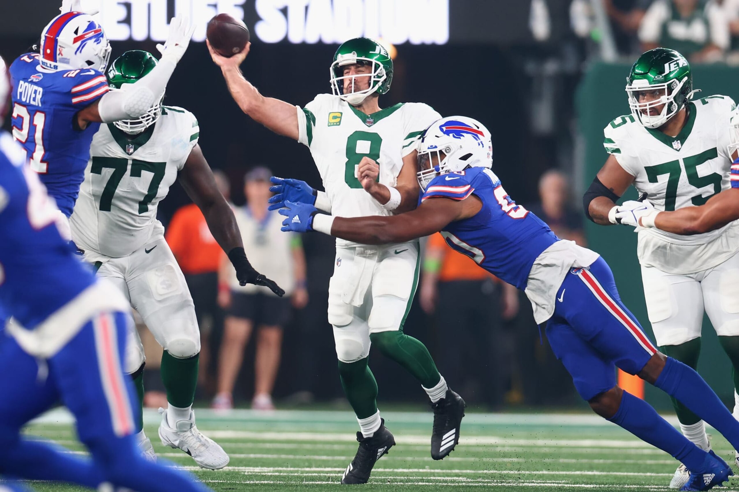 EAST RUTHERFORD, NEW JERSEY - SEPTEMBER 11: Aaron Rodgers #8 of the New York Jets passes as Greg Rousseau #50 of the Buffalo Bills defends in the first quarter of the NFL game at MetLife Stadium on September 11, 2023 in East Rutherford, New Jersey. (Photo by Mike Stobe/Getty Images) EAST RUTHERFORD, NEW JERSEY - SEPTEMBER 11: Aaron Rodgers #8 of the New York Jets passes as Greg Rousseau #50 of the Buffalo Bills defends in the first quarter of the NFL game at MetLife Stadium on September 11, 2023 in East Rutherford, New Jersey. (Photo by Mike Stobe/Getty Images)