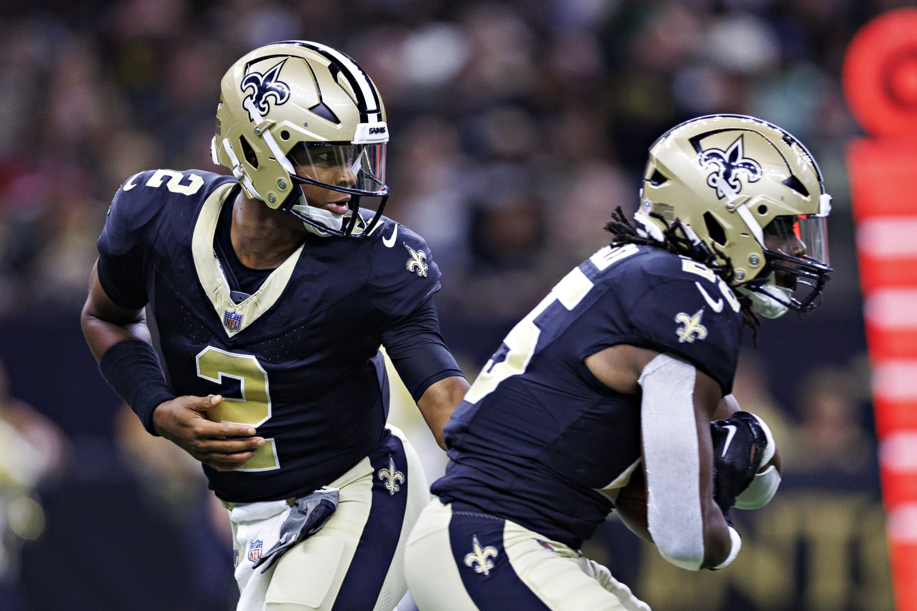 NEW ORLEANS, LOUISIANA - AUGUST 27:  Jameis Winston #2 hands off the ball to Kendre Miller #25 of the New Orleans Saints during the preseason game against the Houston Texans at Caesars Superdome on August 27, 2023 in New Orleans, Louisiana. The Texans defeated the Saints 17-13.  (Photo by Wesley Hitt/Getty Images)