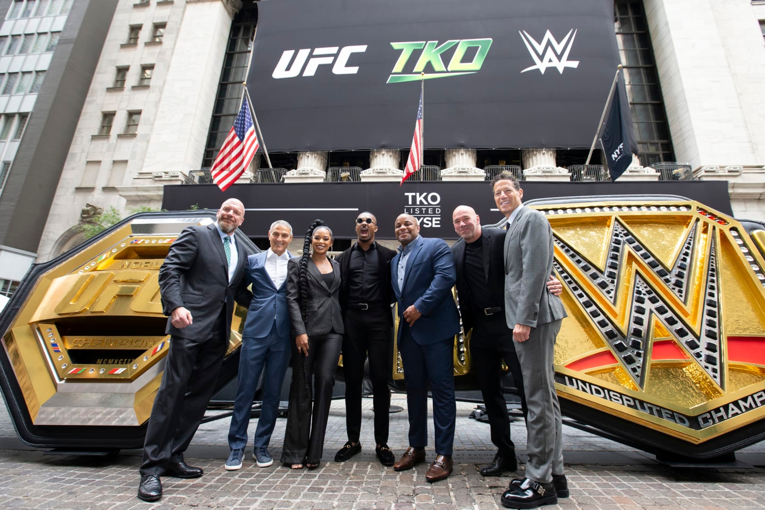 From left to right, WWE Chief Content Officer Paul Levesque, TKO and Endeavor CEO Ariel Emanuel, WWE stars Bianca Belair and Montez Ford, UFC Hall of Famer Daniel Cormier, UFC CEO Dana White, and TKO and Endeavor President and COO Mark Shapiro.