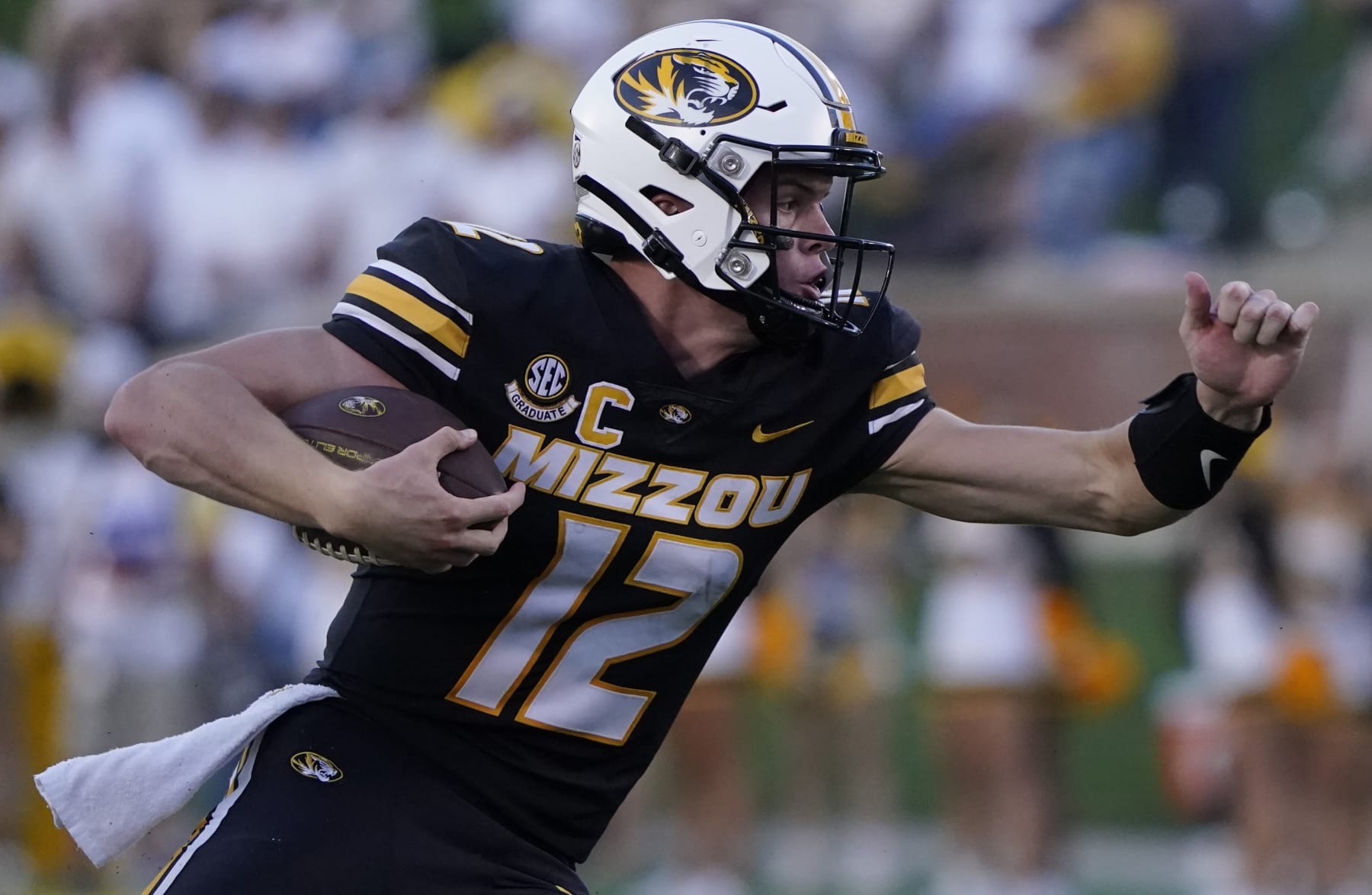 COLUMBIA, MISSOURI - SEPTEMBER 09: Quarterback Brady Cook #12 of the Missouri Tigers runs with the ball against the Middle Tennessee Blue Raiders in the first half at Faurot Field at Memorial Stadium on September 09, 2023 in Columbia, Missouri. (Photo by Ed Zurga/Getty Images)