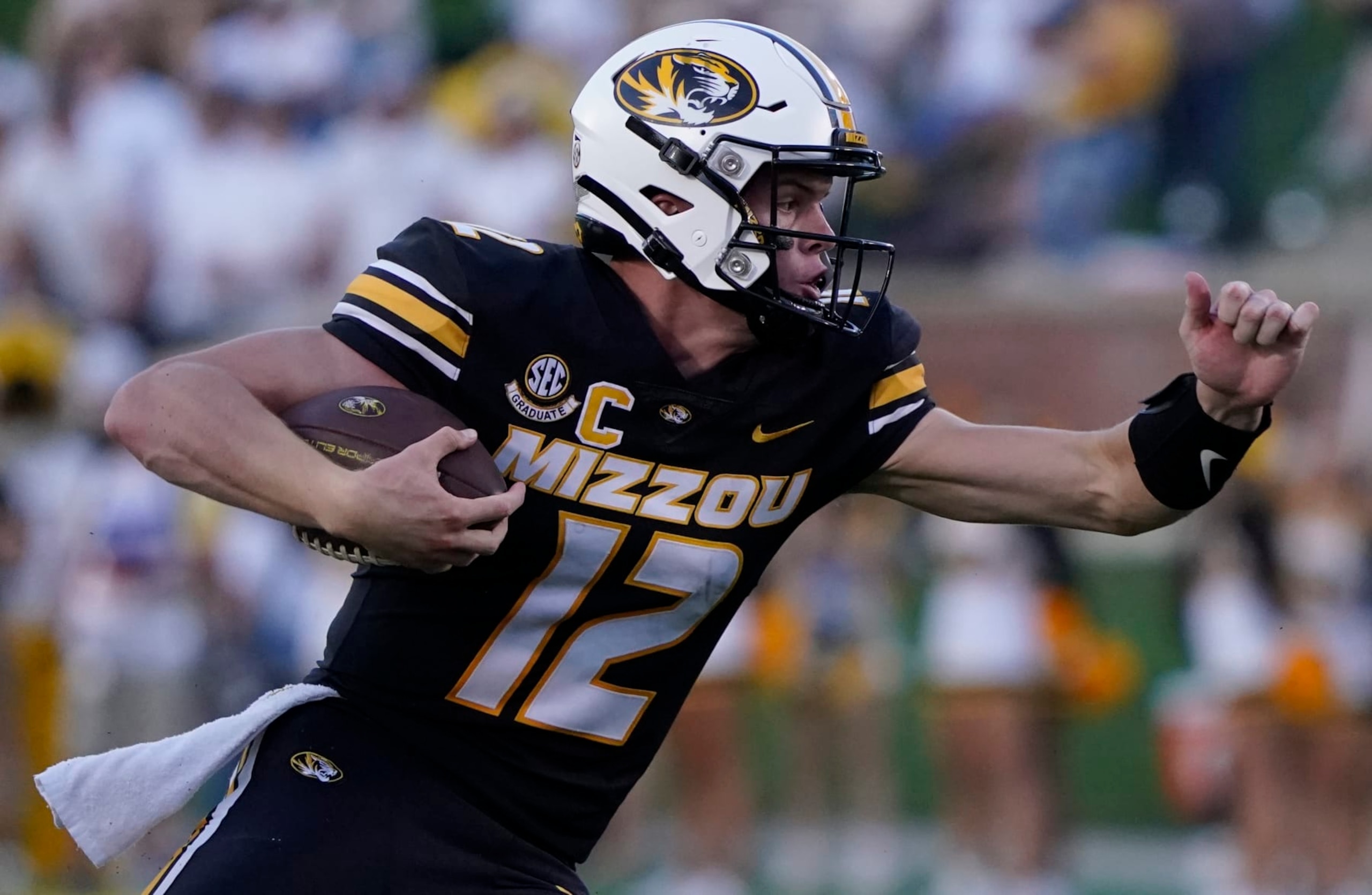 COLUMBIA, MISSOURI - SEPTEMBER 09: Quarterback Brady Cook #12 of the Missouri Tigers runs with the ball against the Middle Tennessee Blue Raiders in the first half at Faurot Field at Memorial Stadium on September 09, 2023 in Columbia, Missouri. (Photo by Ed Zurga/Getty Images) COLUMBIA, MISSOURI - SEPTEMBER 09: Quarterback Brady Cook #12 of the Missouri Tigers runs with the ball against the Middle Tennessee Blue Raiders in the first half at Faurot Field at Memorial Stadium on September 09, 2023 in Columbia, Missouri. (Photo by Ed Zurga/Getty Images)