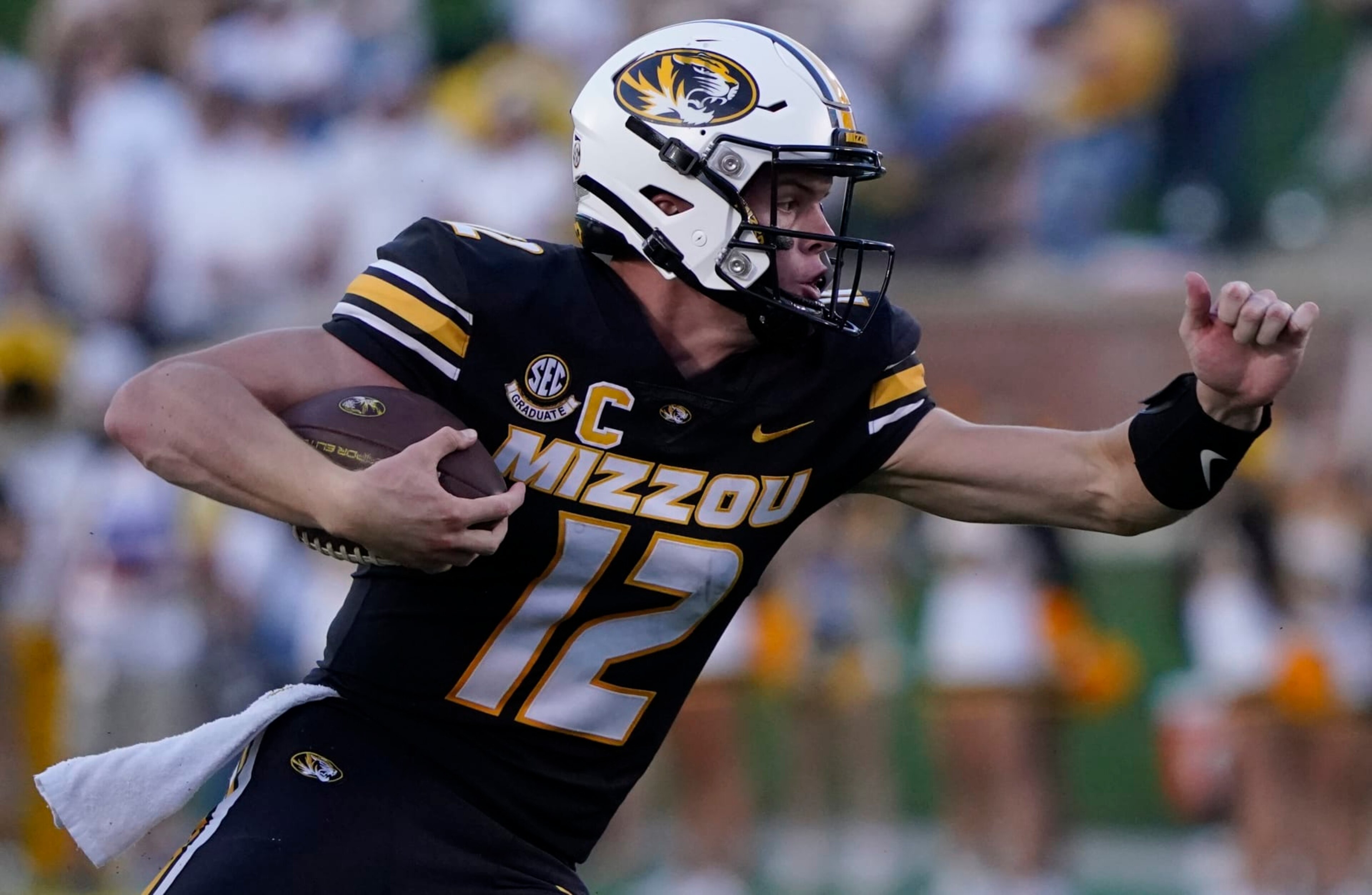COLUMBIA, MISSOURI - SEPTEMBER 09: Quarterback Brady Cook #12 of the Missouri Tigers runs with the ball against the Middle Tennessee Blue Raiders in the first half at Faurot Field at Memorial Stadium on September 09, 2023 in Columbia, Missouri. (Photo by Ed Zurga/Getty Images)