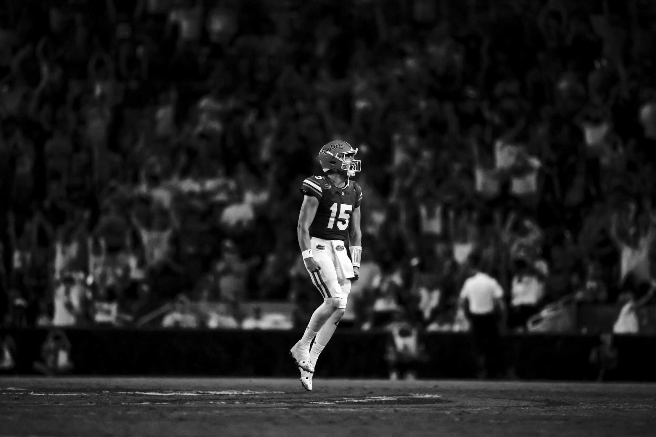 GAINESVILLE, FLORIDA - SEPTEMBER 09: (EDITOR'S NOTE: Image has been converted to black and white) Graham Mertz #15 of the Florida Gators celebrates after scoring a touchdown during the second half of a game against the McNeese State Cowboys at Ben Hill Griffin Stadium on September 09, 2023 in Gainesville, Florida. (Photo by James Gilbert/Getty Images) GAINESVILLE, FLORIDA - SEPTEMBER 09: (EDITOR'S NOTE: Image has been converted to black and white) Graham Mertz #15 of the Florida Gators celebrates after scoring a touchdown during the second half of a game against the McNeese State Cowboys at Ben Hill Griffin Stadium on September 09, 2023 in Gainesville, Florida. (Photo by James Gilbert/Getty Images)