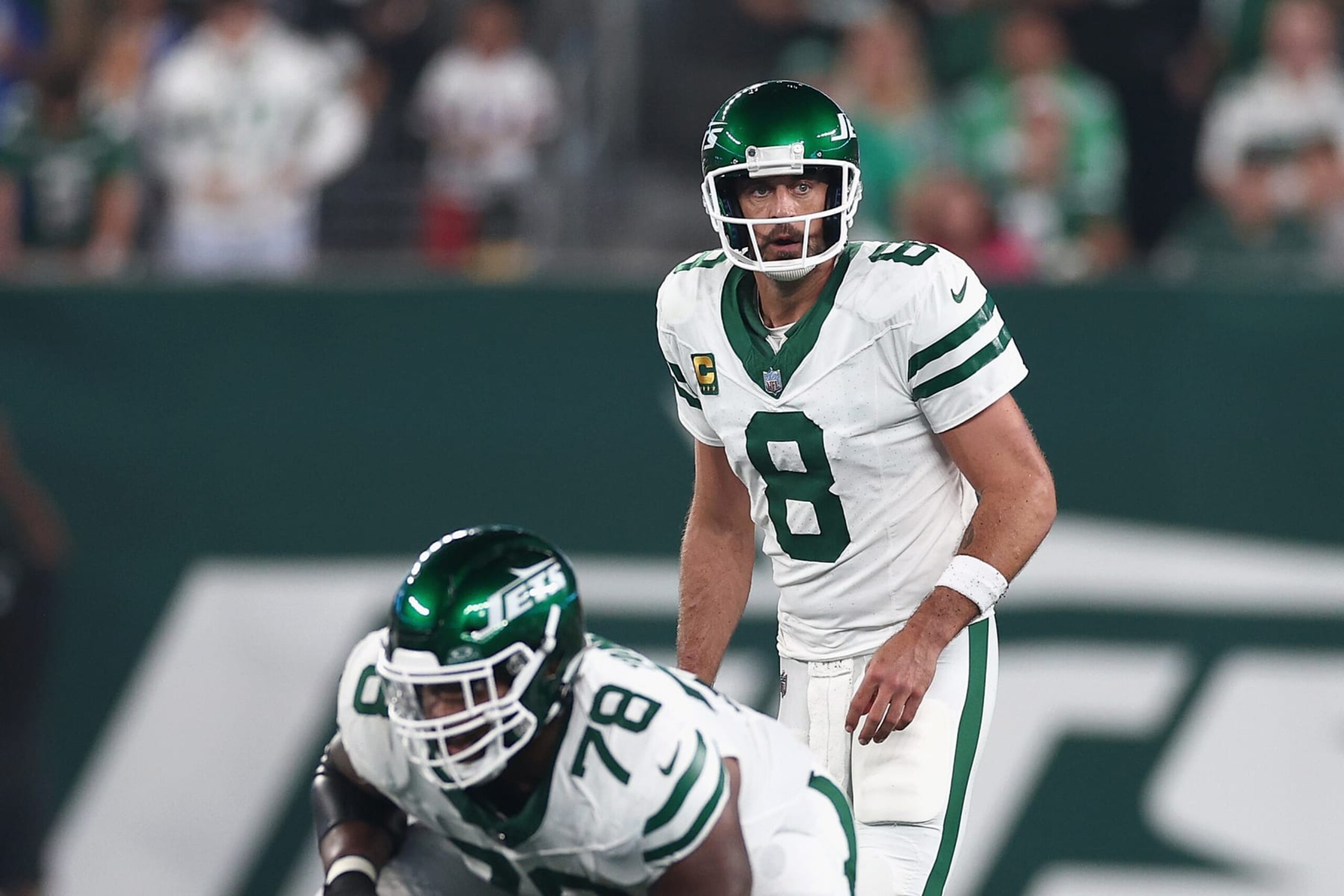 EAST RUTHERFORD, NEW JERSEY - SEPTEMBER 11: Quarterback Aaron Rodgers #8 of the New York Jets prepares to snap the football during the first quarter of the NFL game against the Buffalo Bills at MetLife Stadium on September 11, 2023 in East Rutherford, New Jersey. (Photo by Elsa/Getty Images)