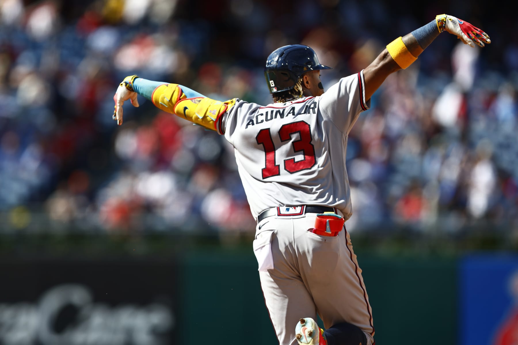 PHILADELPHIA, PENNSYLVANIA - SEPTEMBER 11: Ronald Acuna Jr. #13 of the Atlanta Braves flaps his arms after hitting a home run against the Philadelphia Phillies in the sixth inning during game one of a doubleheader at Citizens Bank Park on September 11, 2023 in Philadelphia, Pennsylvania. The Braves defeated the Phillies 10-8 in 10 innings. (Photo by Rich Schultz/Getty Images)