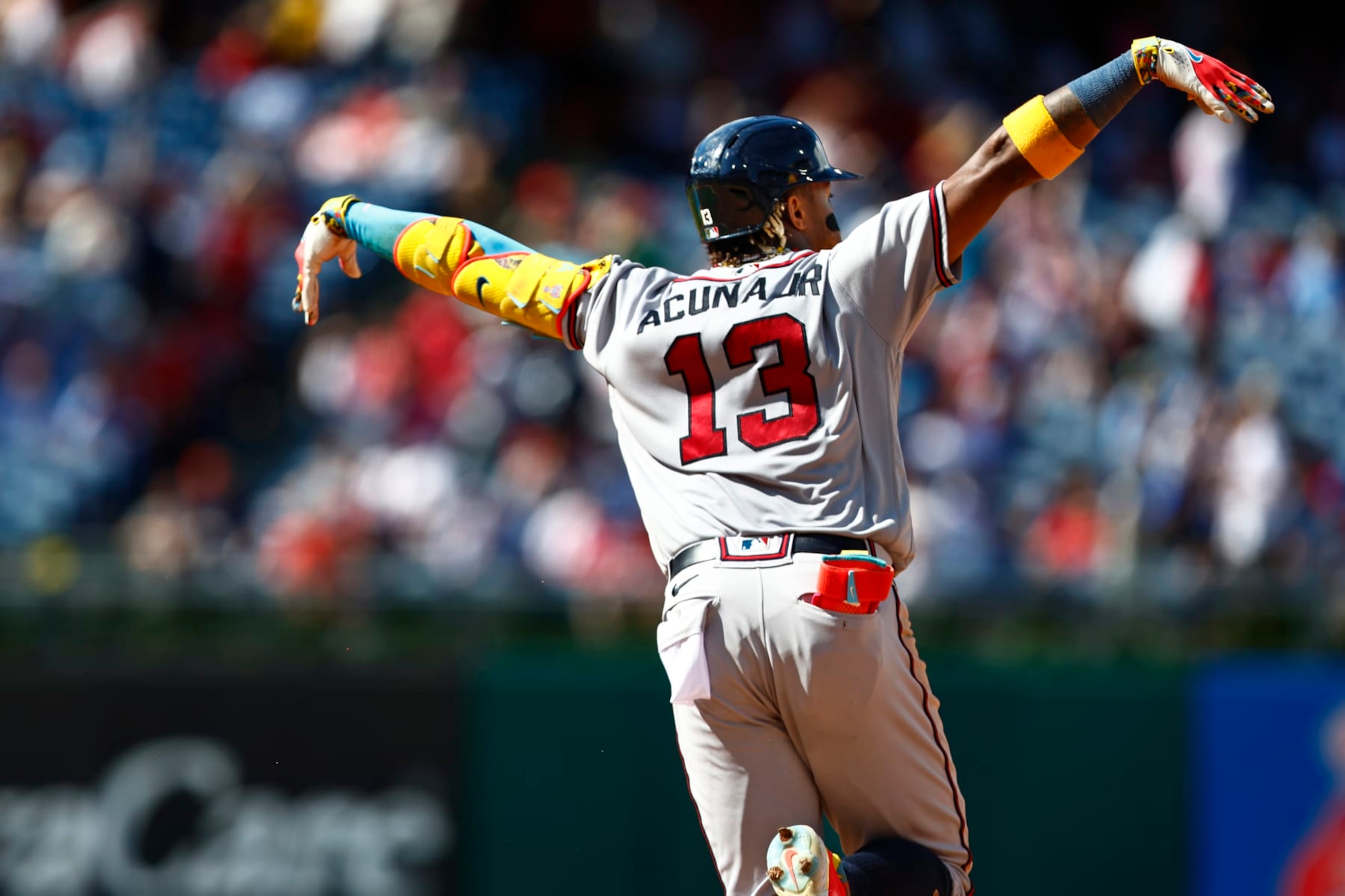 PHILADELPHIA, PENNSYLVANIA - SEPTEMBER 11: Ronald Acuna Jr. #13 of the Atlanta Braves flaps his arms after hitting a home run against the Philadelphia Phillies in the sixth inning during game one of a doubleheader at Citizens Bank Park on September 11, 2023 in Philadelphia, Pennsylvania. The Braves defeated the Phillies 10-8 in 10 innings. (Photo by Rich Schultz/Getty Images)