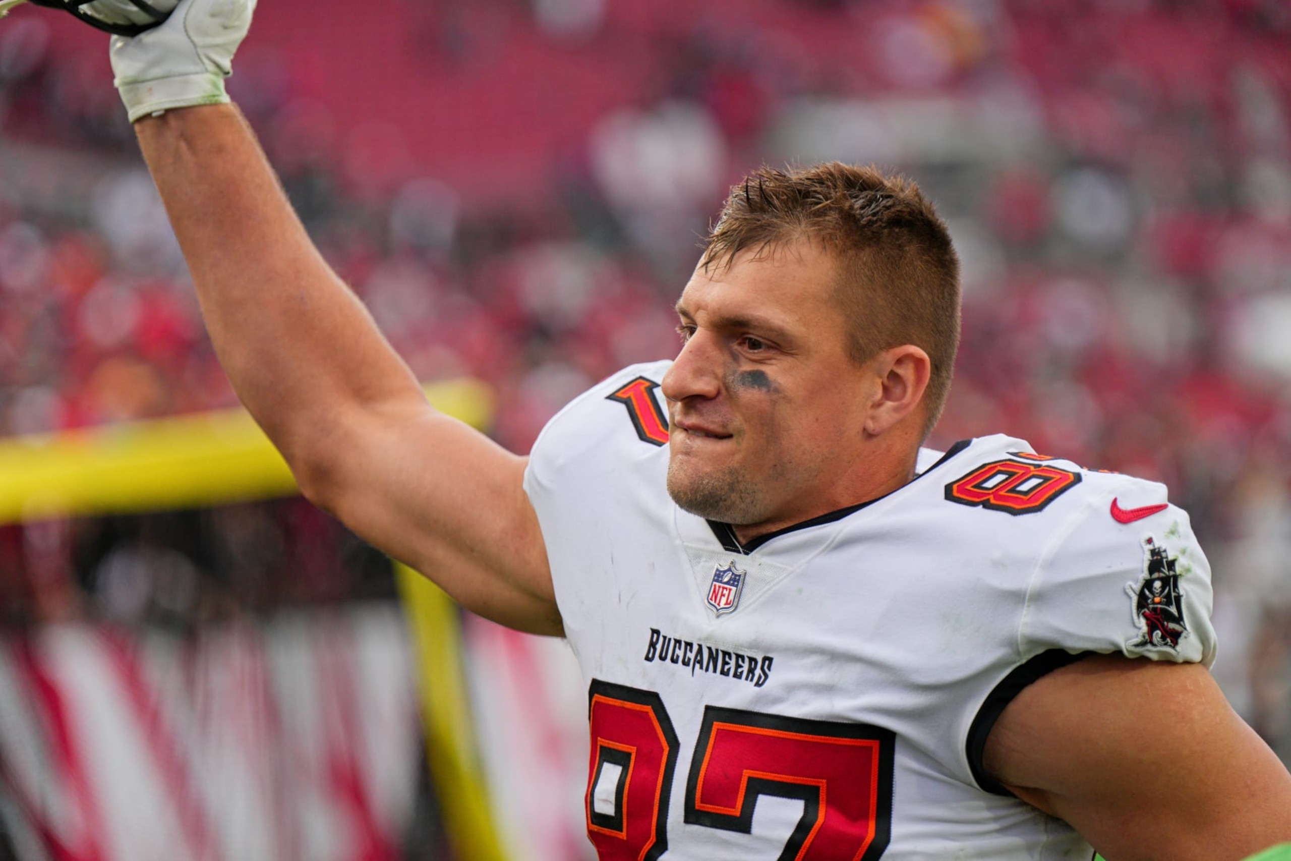 TAMPA, FL - JANUARY 16: Tampa Bay Buccaneers tight end Rob Gronkowski (87) waves to the crowd during the game between the Philadelphia Eagles and the Tampa Bay Buccaneers on January 16, 2022 at  Raymond James Stadium in Tampa, FL. (Photo by Andy Lewis/Icon Sportswire via Getty Images)