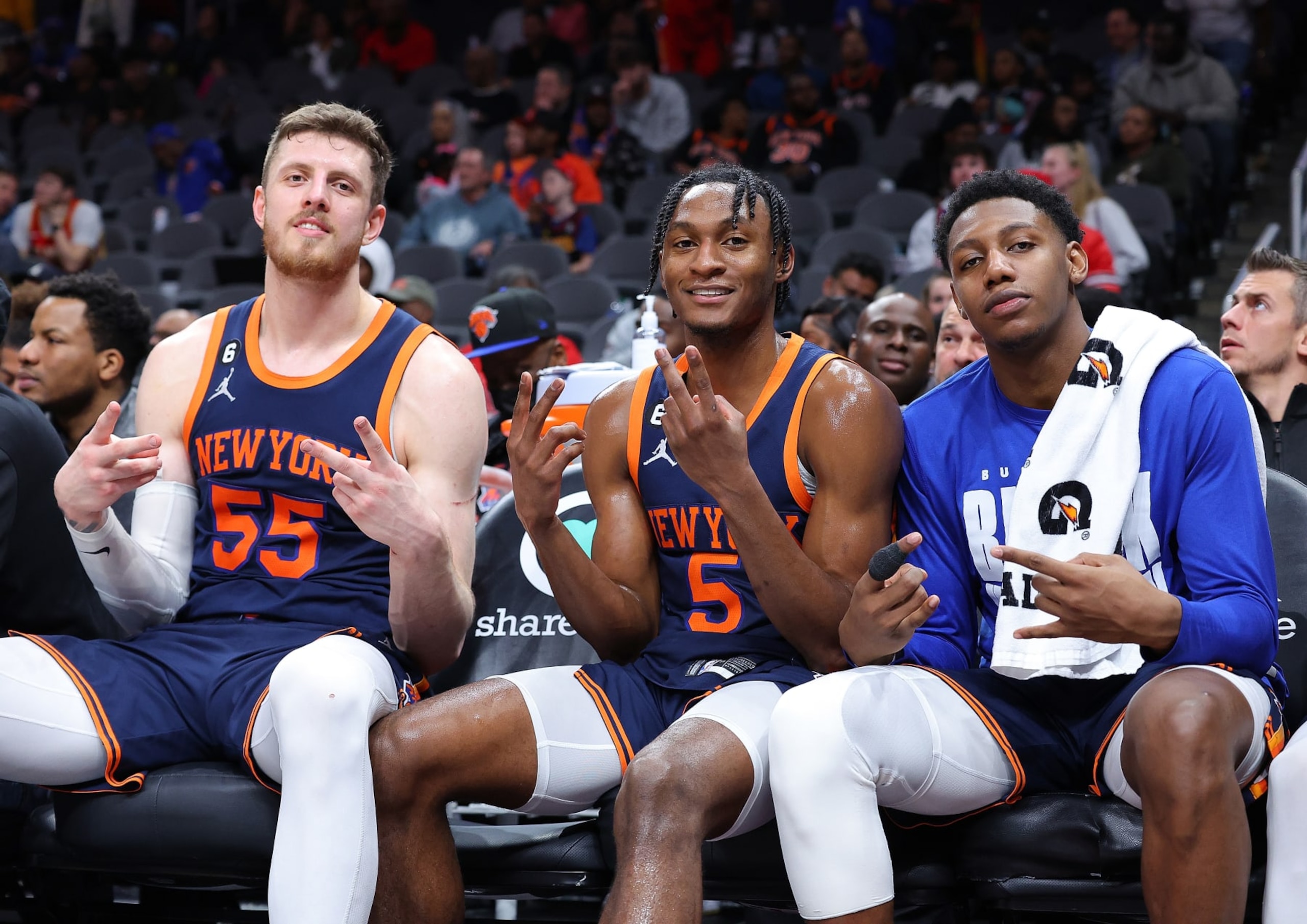 ATLANTA, GEORGIA - FEBRUARY 15:  Isaiah Hartenstein #55, Immanuel Quickley #5 and RJ Barrett #9 of the New York Knicks pose for a picture in the final seconds of their 122-101 win over the Atlanta Hawks during the fourth quarter at State Farm Arena on February 15, 2023 in Atlanta, Georgia.  NOTE TO USER: User expressly acknowledges and agrees that, by downloading and or using this photograph, User is consenting to the terms and conditions of the Getty Images License Agreement.  (Photo by Kevin C. Cox/Getty Images)