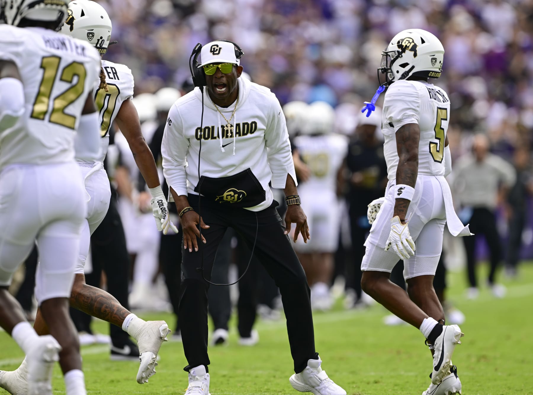 FT. WORTH, TX - SEPTEMBER 02: Colorado Buffaloes head coach Deion Sanders gets fired up as players Travis Hunter, (12), Xavier Weaver, (10) and Jimmy Horn Jr. (5) come off the field during the game against the TCU Horned Frogs at Amon G. Carter Stadium in Ft. Worth September 02, 2023. (Photo by Andy Cross/MediaNews Group/The Denver Post via Getty Images)