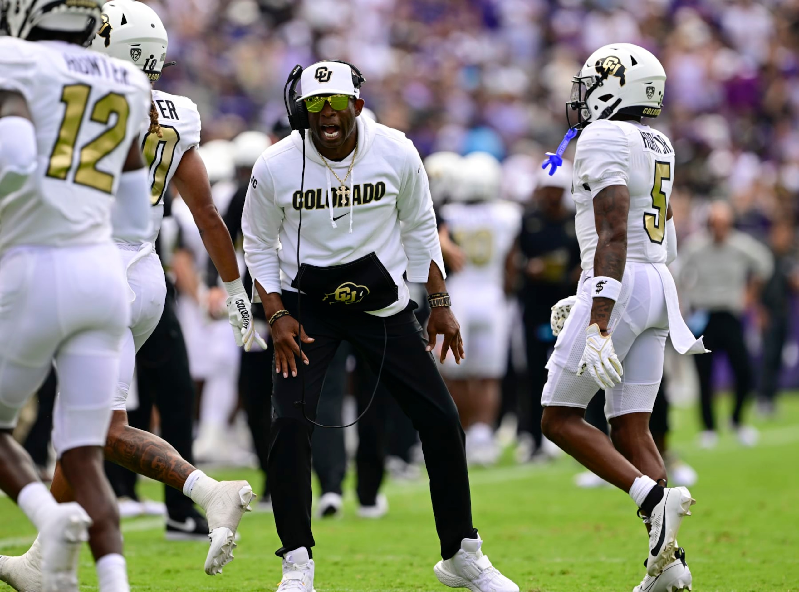 FT. WORTH, TX - SEPTEMBER 02: Colorado Buffaloes head coach Deion Sanders gets fired up as players Travis Hunter, (12), Xavier Weaver, (10) and Jimmy Horn Jr. (5) come off the field during the game against the TCU Horned Frogs at Amon G. Carter Stadium in Ft. Worth September 02, 2023. (Photo by Andy Cross/MediaNews Group/The Denver Post via Getty Images)