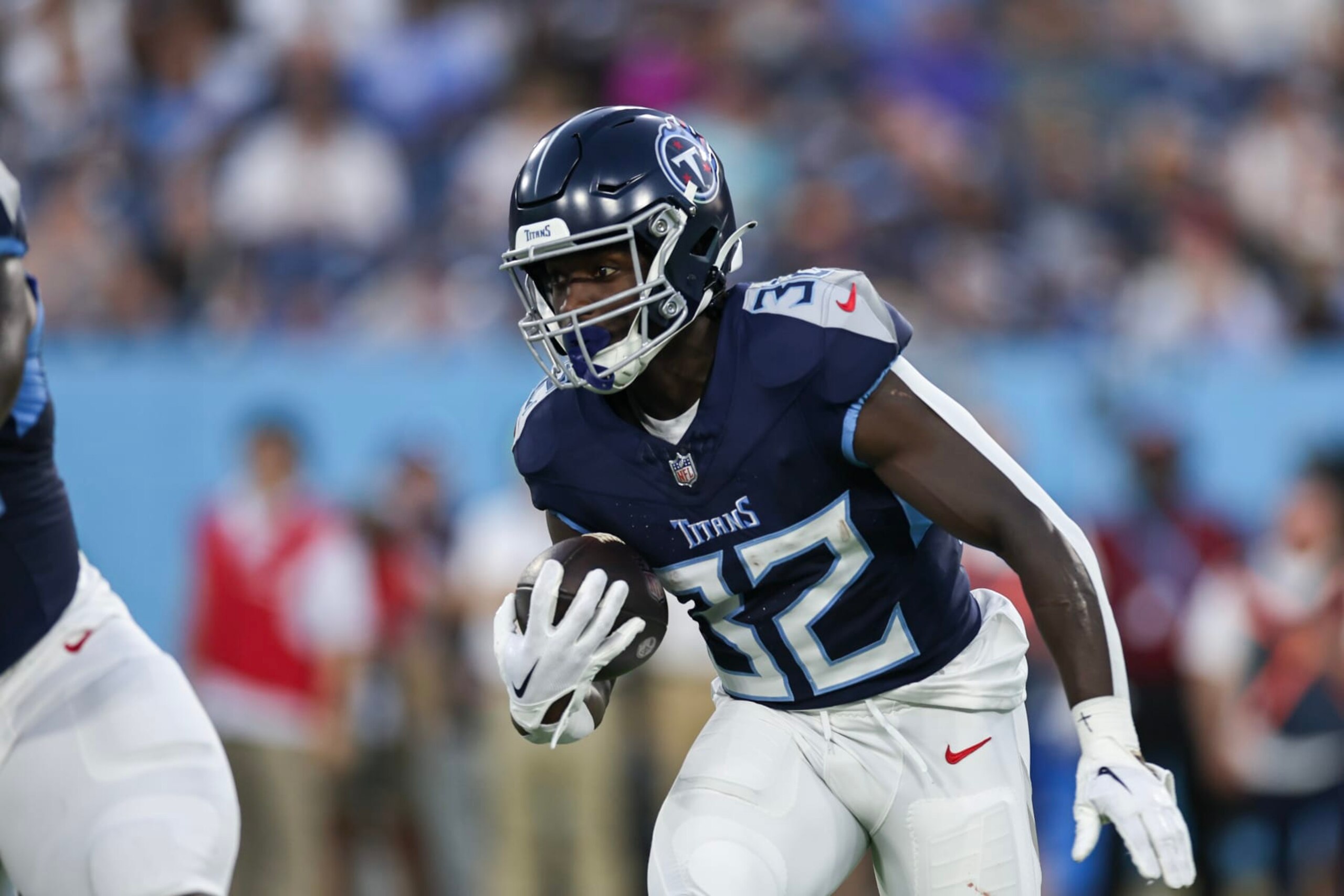 NASHVILLE, TENNESSEE - AUGUST 25: Tyjae Spears #32 of the Tennessee Titans rushes with the ball against the New England Patriots during the preseason game at Nissan Stadium on August 25, 2023 in Nashville, Tennessee. (Photo by Silas Walker/Getty Images)