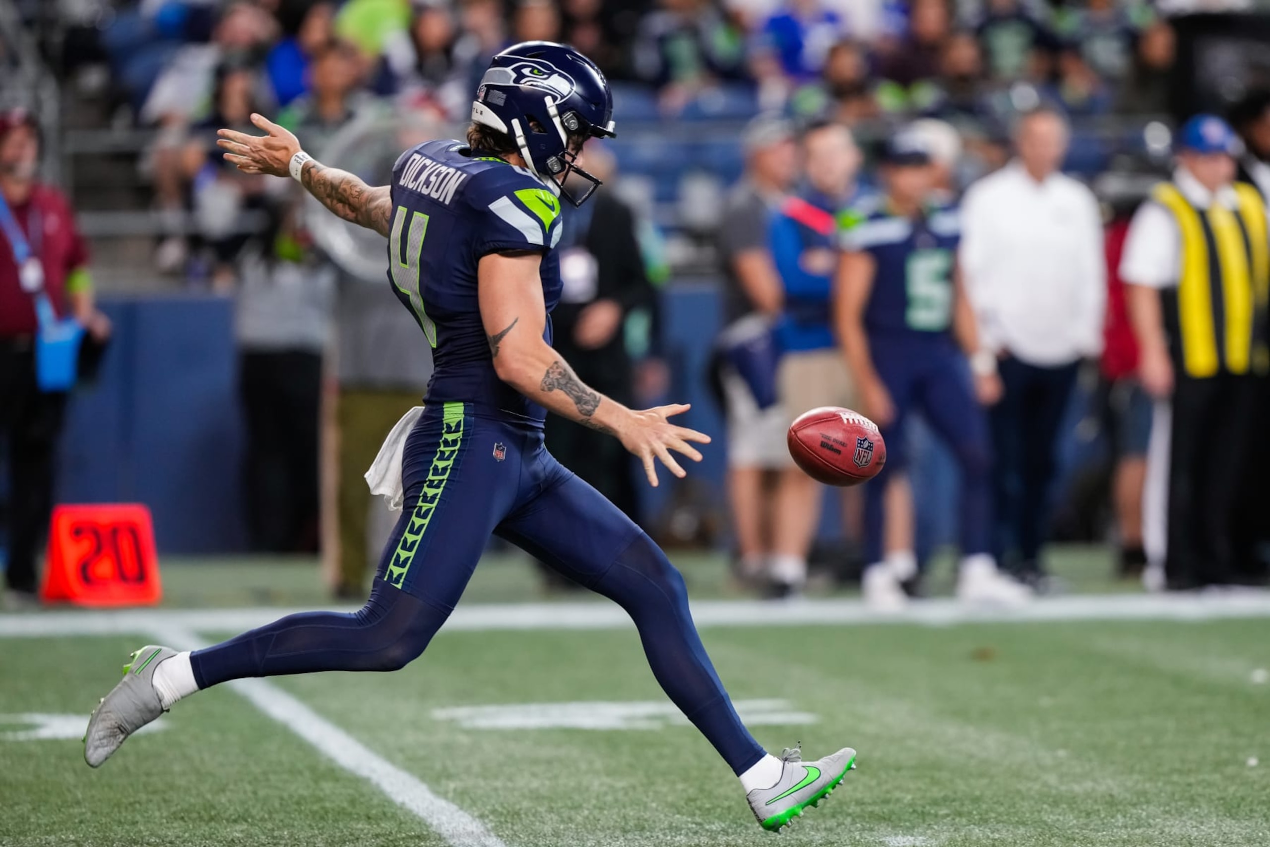 SEATTLE, WASHINGTON - AUGUST 10: Punter Michael Dickson #4 of the Seattle Seahawks punts the football during the second half of a preseason game against the Minnesota Vikings at Lumen Field on August 10, 2023 in Seattle, Washington. (Photo by Christopher Mast/Getty Images)