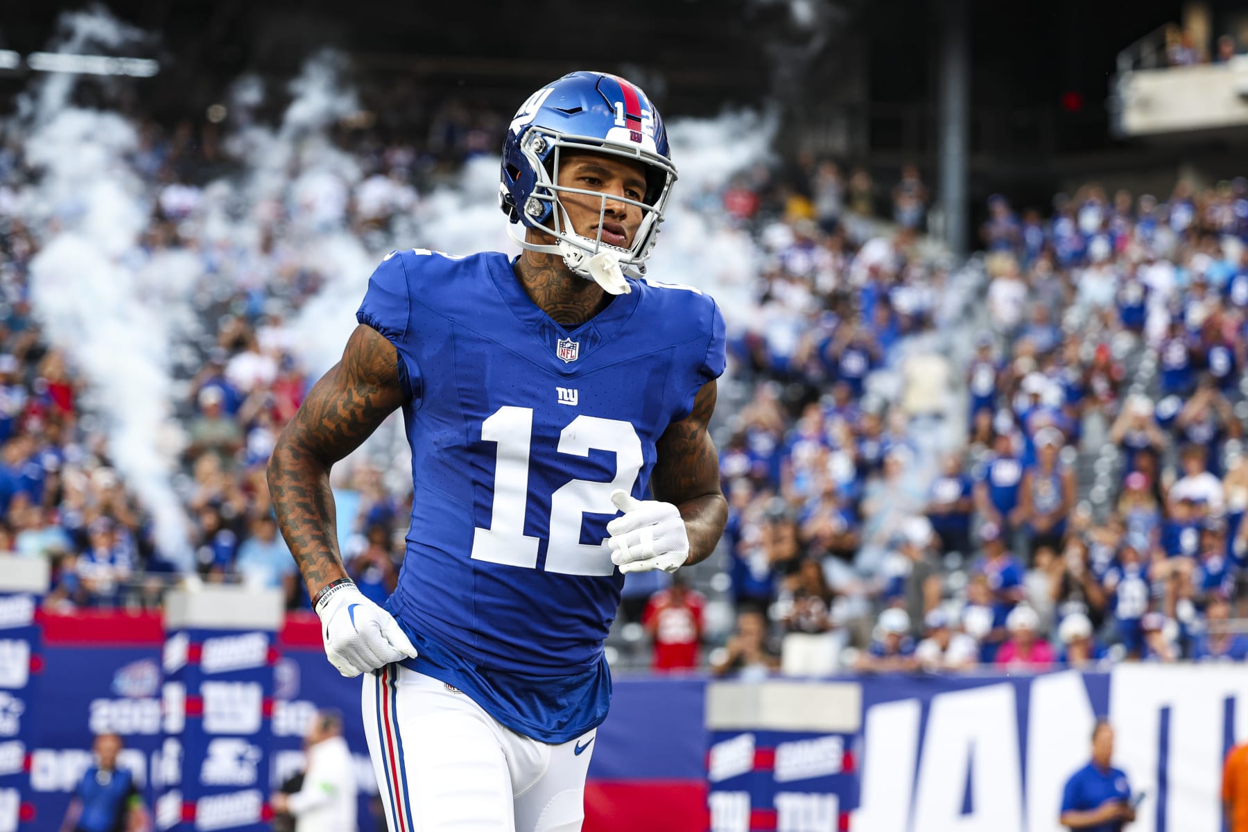 EAST RUTHERFORD, NJ - AUGUST 18: Darren Waller #12 of the New York Giants runs onto the field against the Carolina Panthers during the first half at MetLife Stadium on Friday, August 18, 2023, in East Rutherford, New Jersey. (Perry Knotts/Getty Images)