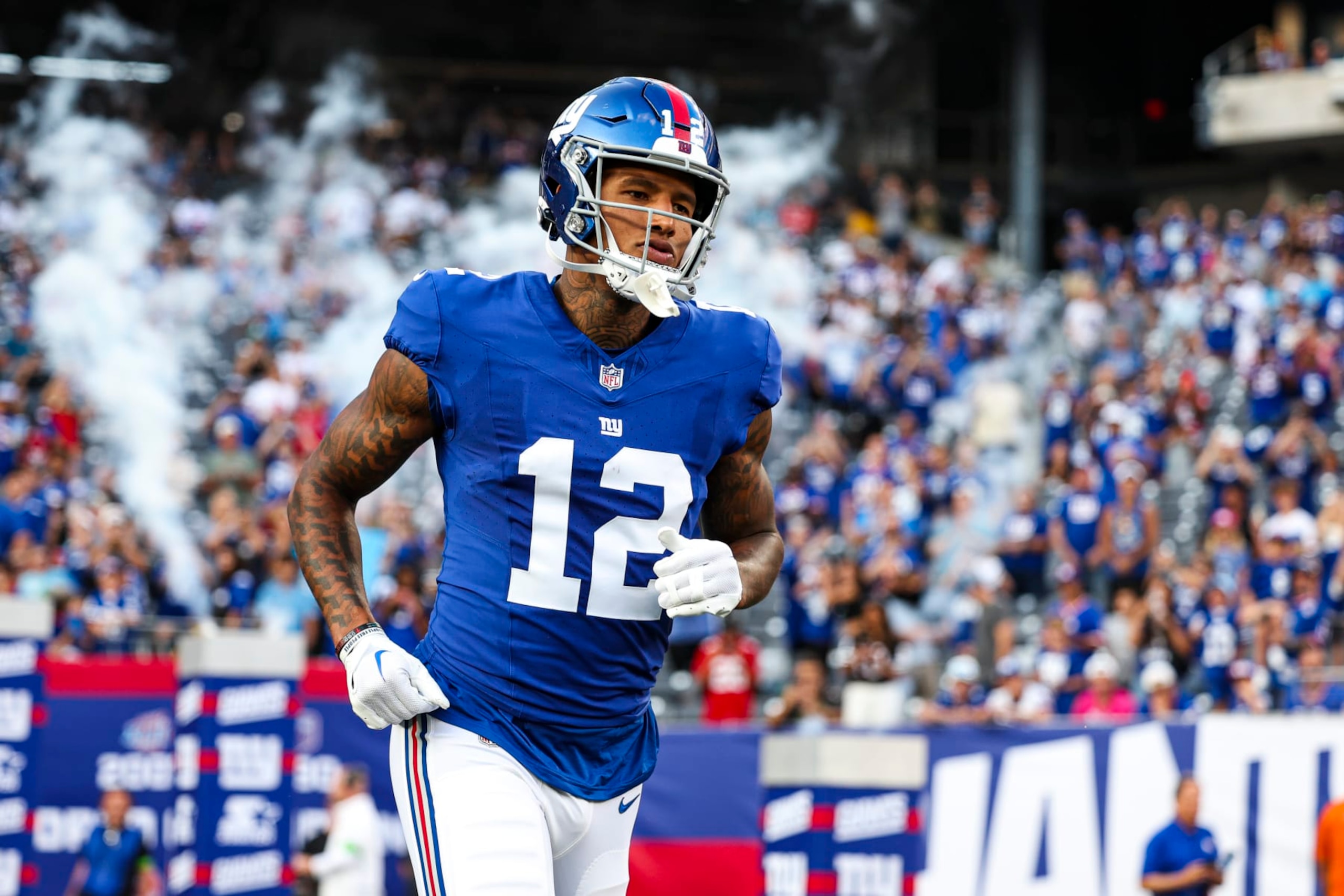 EAST RUTHERFORD, NJ - AUGUST 18: Darren Waller #12 of the New York Giants runs onto the field against the Carolina Panthers during the first half at MetLife Stadium on Friday, August 18, 2023, in East Rutherford, New Jersey. (Perry Knotts/Getty Images)
