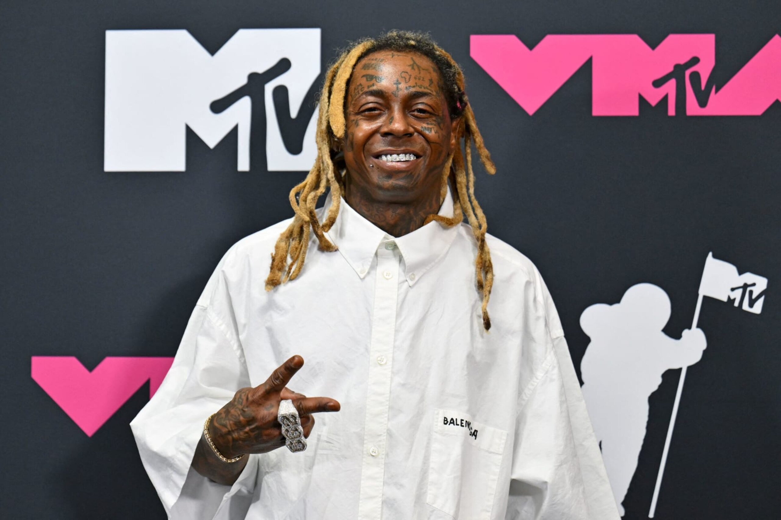 US rapper Lil Wayne poses in the press room during the MTV Video Music Awards at the Prudential Center in Newark, New Jersey, on September 12, 2023. (Photo by ANGELA WEISS / AFP) (Photo by ANGELA WEISS/AFP via Getty Images) US rapper Lil Wayne poses in the press room during the MTV Video Music Awards at the Prudential Center in Newark, New Jersey, on September 12, 2023. (Photo by ANGELA WEISS / AFP) (Photo by ANGELA WEISS/AFP via Getty Images)
