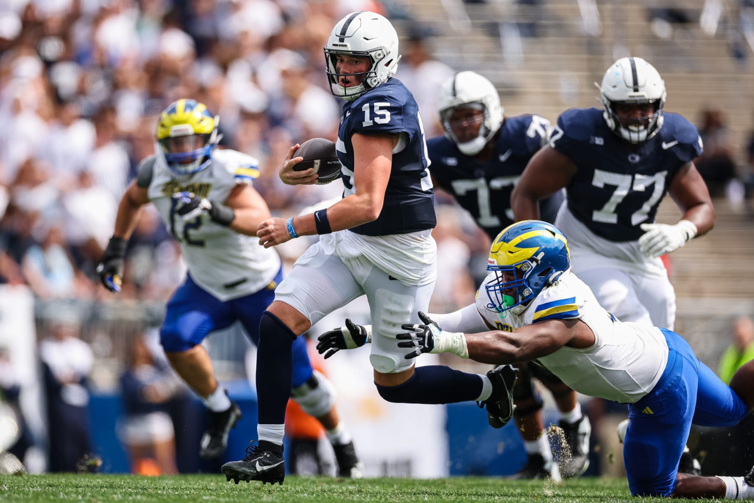 STATE COLLEGE, PA - SEPTEMBER 09: Drew Allar #15 of the Penn State Nittany Lions carries the ball against the Delaware Fightin Blue Hens during the first half at Beaver Stadium on September 9, 2023 in State College, Pennsylvania. (Photo by Scott Taetsch/Getty Images)