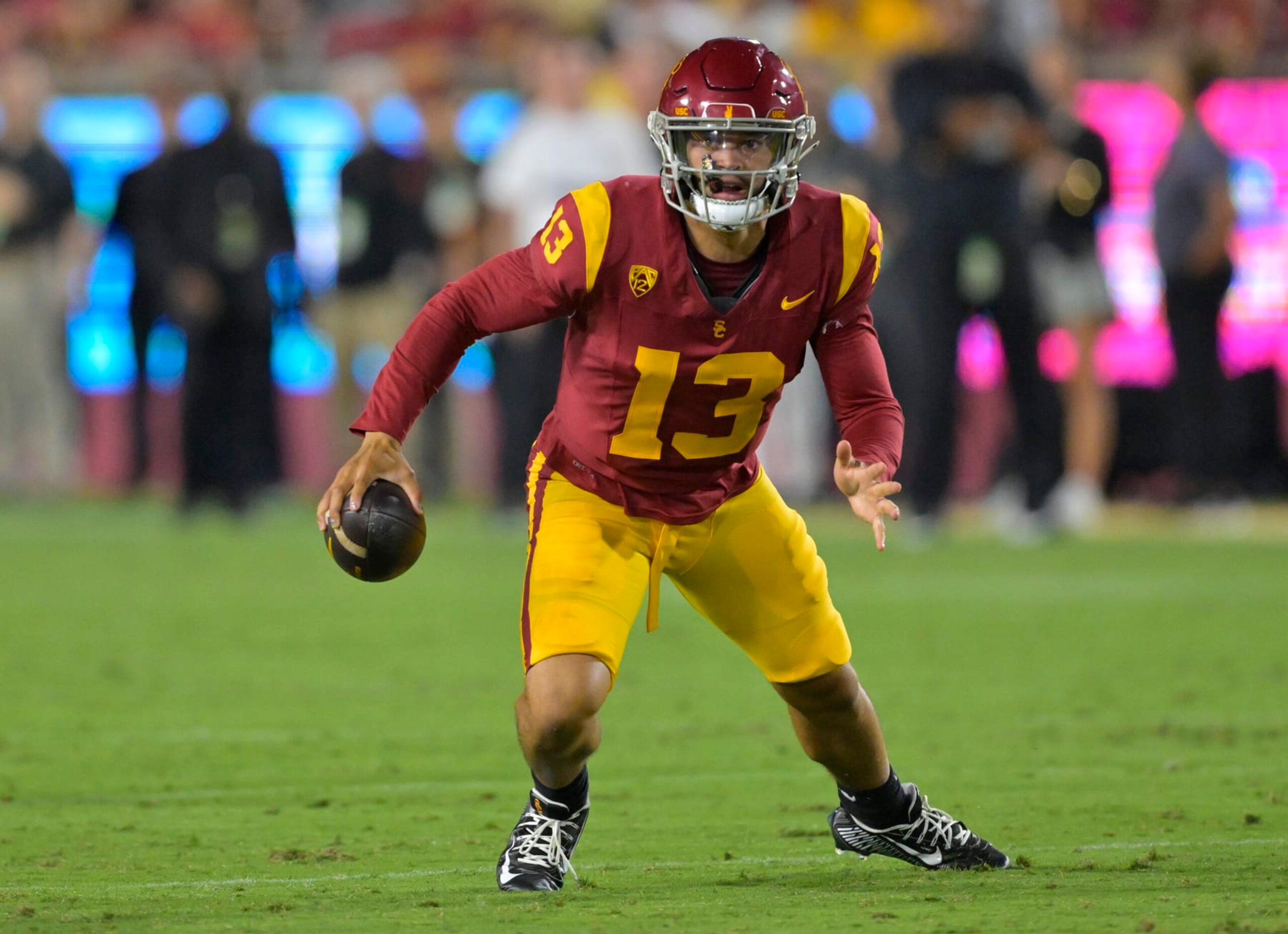 LOS ANGELES, CALIFORNIA - SEPTEMBER 9: Quarterback Caleb Williams #13 of the USC Trojans scrambles in the pocket in the game against the Stanford Cardinal at United Airlines Field at the Los Angeles Memorial Coliseum on September 9, 2023 in Los Angeles, California. (Photo by Jayne Kamin-Oncea/Getty Images)