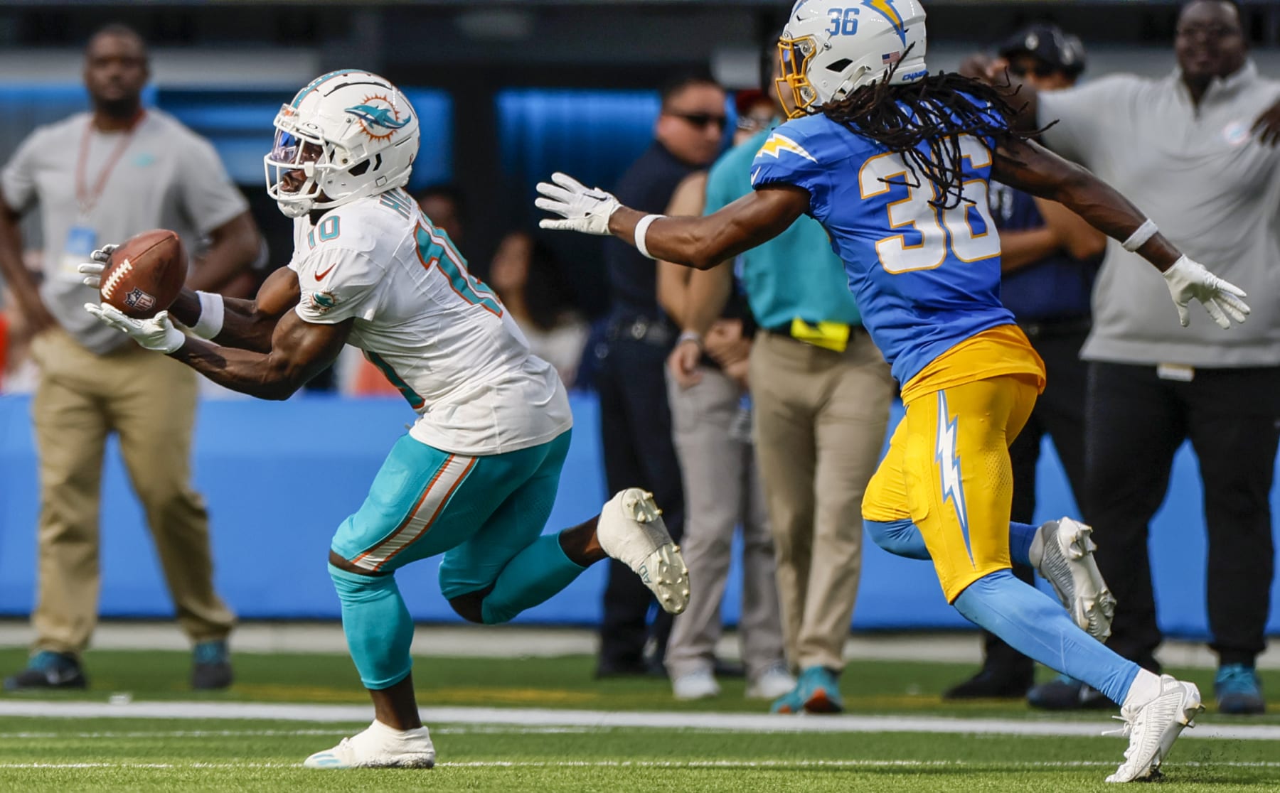 Inglewood, CA, Sunday, Sept. 10, 2023 - Miami Dolphins wide receiver Tyreek Hill (10) hauls in a 47-yard pass over Los Angeles Chargers cornerback Ja'Sir Taylor (36) to keep a fourth quarter game-winning scoring drive alive at SoFi Stadium. (Robert Gauthier/Los Angeles Times via Getty Images)