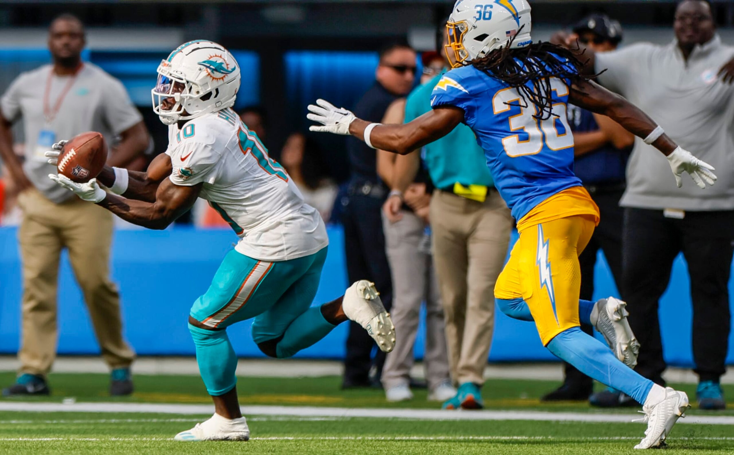 Inglewood, CA, Sunday, Sept. 10, 2023 - Miami Dolphins wide receiver Tyreek Hill (10) hauls in a 47-yard pass over Los Angeles Chargers cornerback Ja'Sir Taylor (36) to keep a fourth quarter game-winning scoring drive alive at SoFi Stadium. (Robert Gauthier/Los Angeles Times via Getty Images)